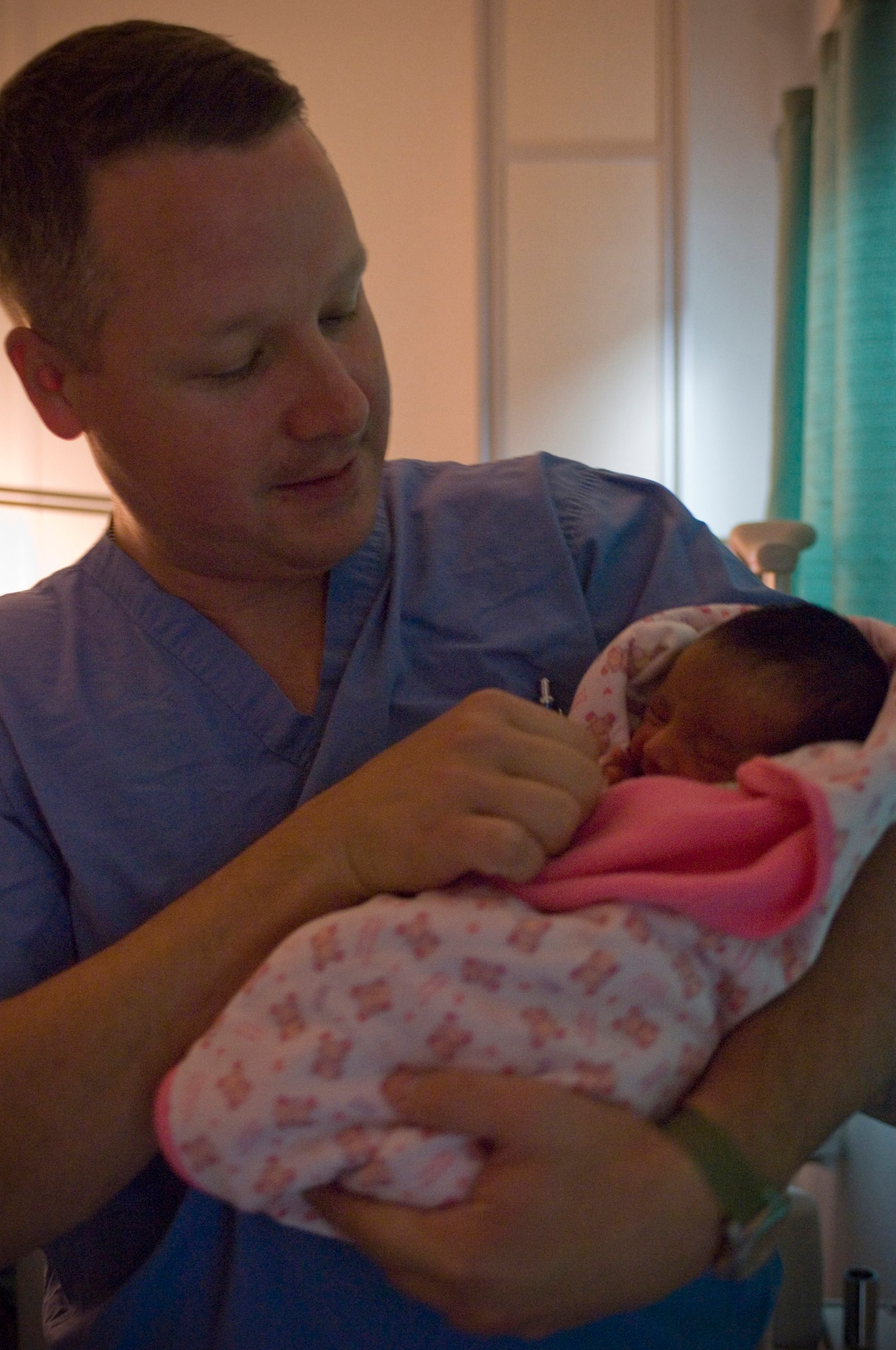 Capt. (Dr.) Brian Hearn, an obstetrics/gynecology physician, checks on Zahra, the first Afghan baby born at the Craig Joint Theater Hospital, at Bagram Air Field, Afghanistan, Oct. 8. Although he is deployed to work as a general physician and surgeon, Doctor Hearn, like many of the hospital staff members, is using his home-station experience to help care for the newborn. (U.S. Air Force photo by Staff Sgt. Rachel Martinez)