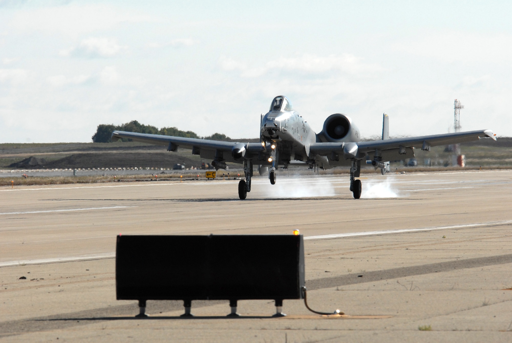 An A-10 Thunderbolt II from the 917th Wing, an Air Force Reserve Command unit from Barksdale Air Force Base, La., touches down at the Salina, Kan., airport Oct. 15 for Hawgsmoke 2008.  Fourteen A-10 squadrons from active duty, Air Force Reserve and Air National Guard units from around the world are competing in a bienniel bombing and gunnery competition, which is being hosted in Salina and at the nearby Smoky Hill Range.  The competition will end Oct. 18 after determining a Hawgsmoke champion, which will host the 2010 event.  (U.S. Air Force photo/Maj. David Kurle)