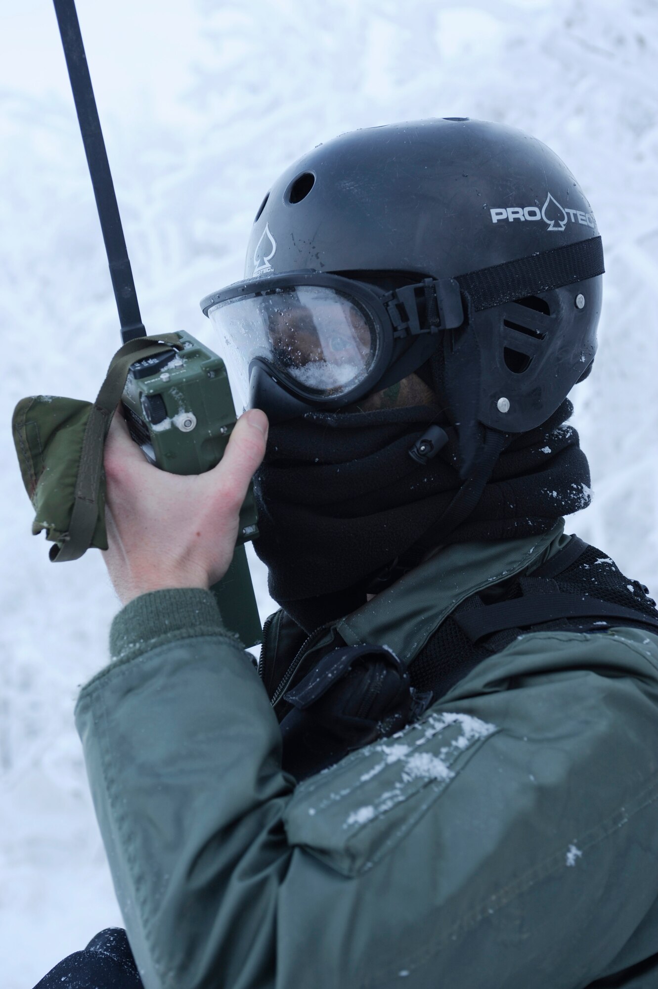 1st Lt. Matthew Feeman, 80th Fighter Squadron, Kunsan Air Base, Korea uses a PRC-112 radio to communicate with friendly forces in efforts to extract him from the area during RED FLAG-Alaska 09-1 Oct. 14, 2008, at Eielson Air Force Base, Alaska. Lieutenant Feeman is playing the role of a pilot who was shot down behind enemy lines and he must now survive, evade, resist and escape to successfully complete the training mission.  (U.S. Air Force photo/Senior Airman Jonathan Snyder)