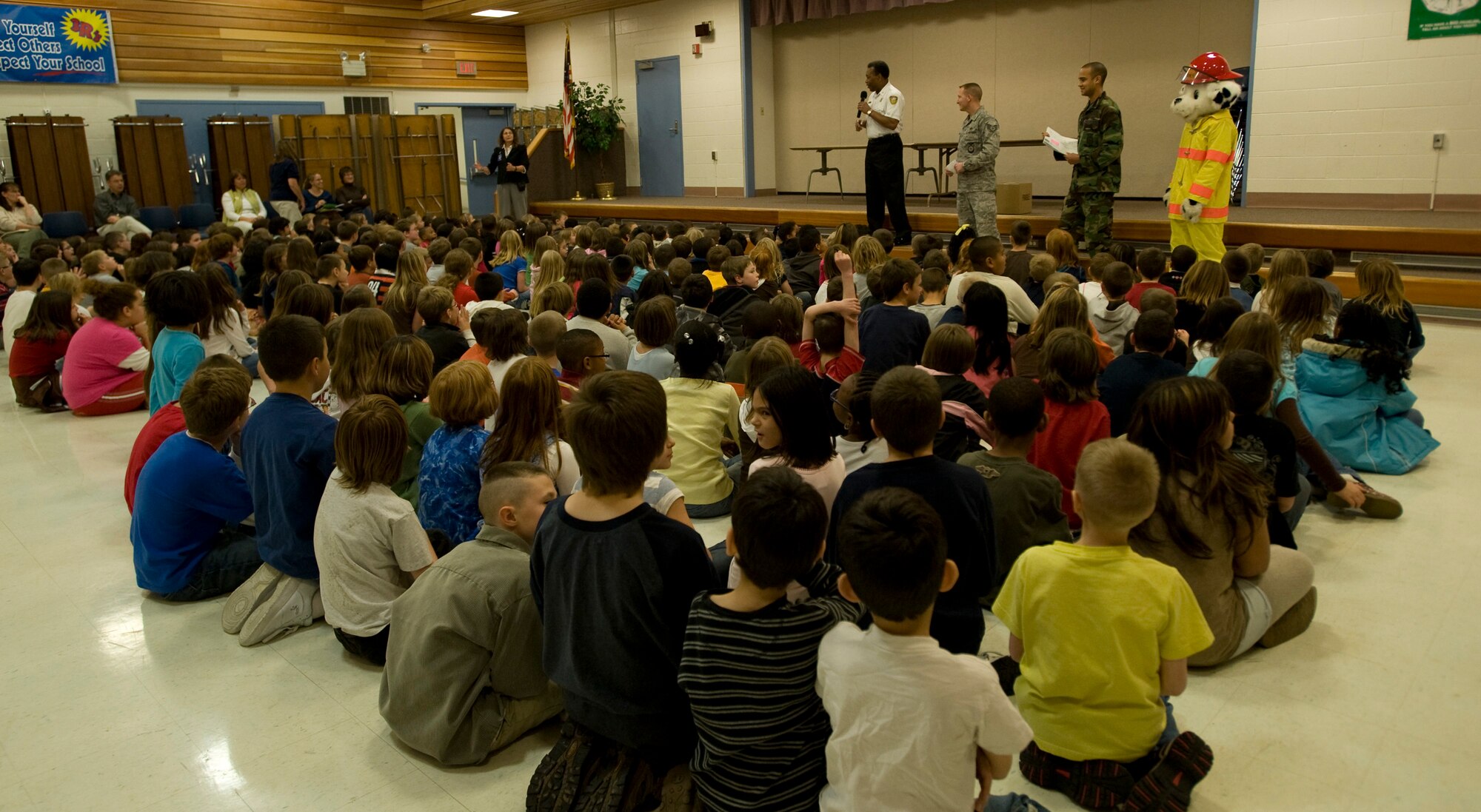 ELMENDORF AIR FORCE BASE, Alaska -- Ford Brooks, Fire Protection Flight deputy fire chief, teaches the children at Orion Elementary School the importance of Fire Safety. Fire can spread rapidly through your home, leaving you as little as two minutes to escape safely once the alarm sounds. (U.S. Air Force photo/Airman 1st Class Kristin High)