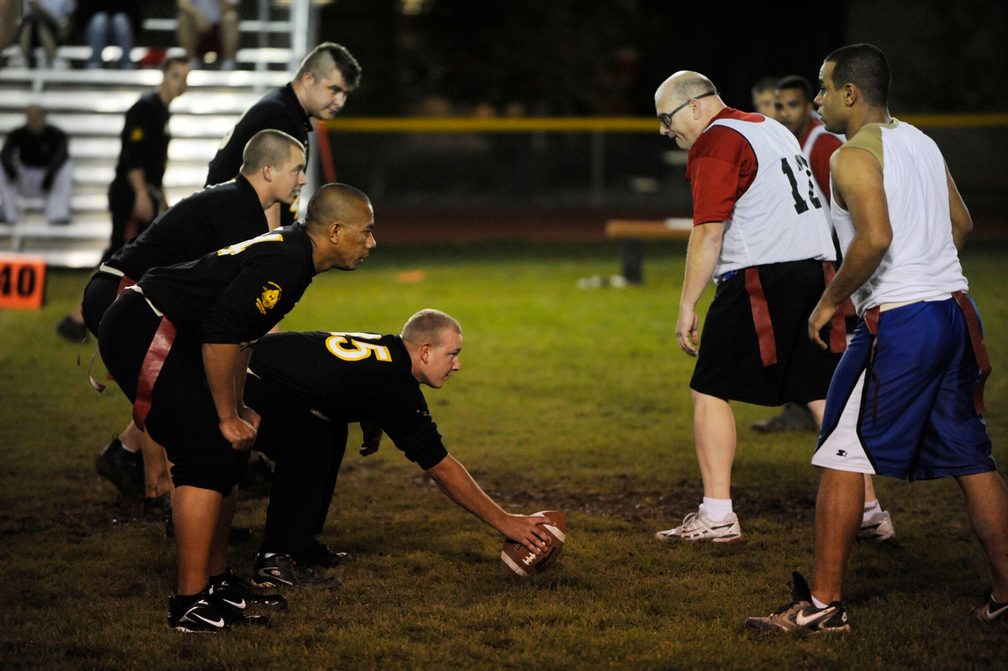 MOUNTAIN HOME AIR FORCE BASE, Idaho -- Members of Airmen Committed to Excellence (black shirts) face off against the 366th Force Support Squadron team Oct. 6. A.C.E. joined the flag football season with their own team while the 366th Services Squadron and 366th Mission Support Squadron have merged and created the 366th FSS. A.C.E. clobbered 366th FSS 14-8. The flag football season runs until Nov. 25. (U.S. Air Force photo/Airman 1st Class Ryan Crane)
