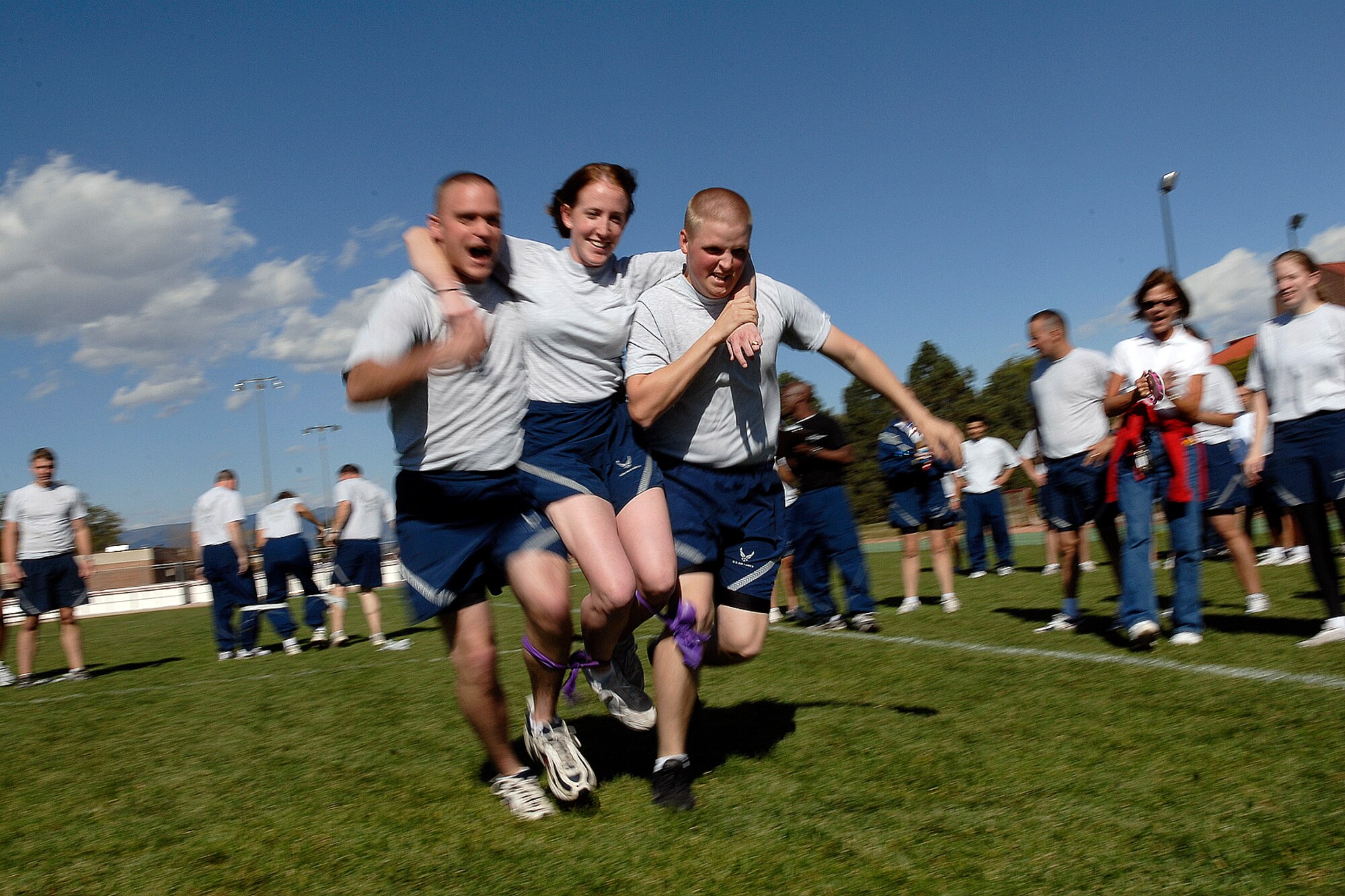 Members of the 21st Comptroller Squadron team get two legs up to try for the best time during the 4-legged relay race portion of Wingman’s Day at Peterson AFB on Oct.10. The 4-legged race was designed to immulate the new and creative ways that Airmen, civilians and contractors work as a team in today's Air Force. The Air Force established the Wingman program to encourage Airmen and their families to look out for each other and to intervene when signs of stress are observed. It's a promise, a pledge, a commitment between Airmen.