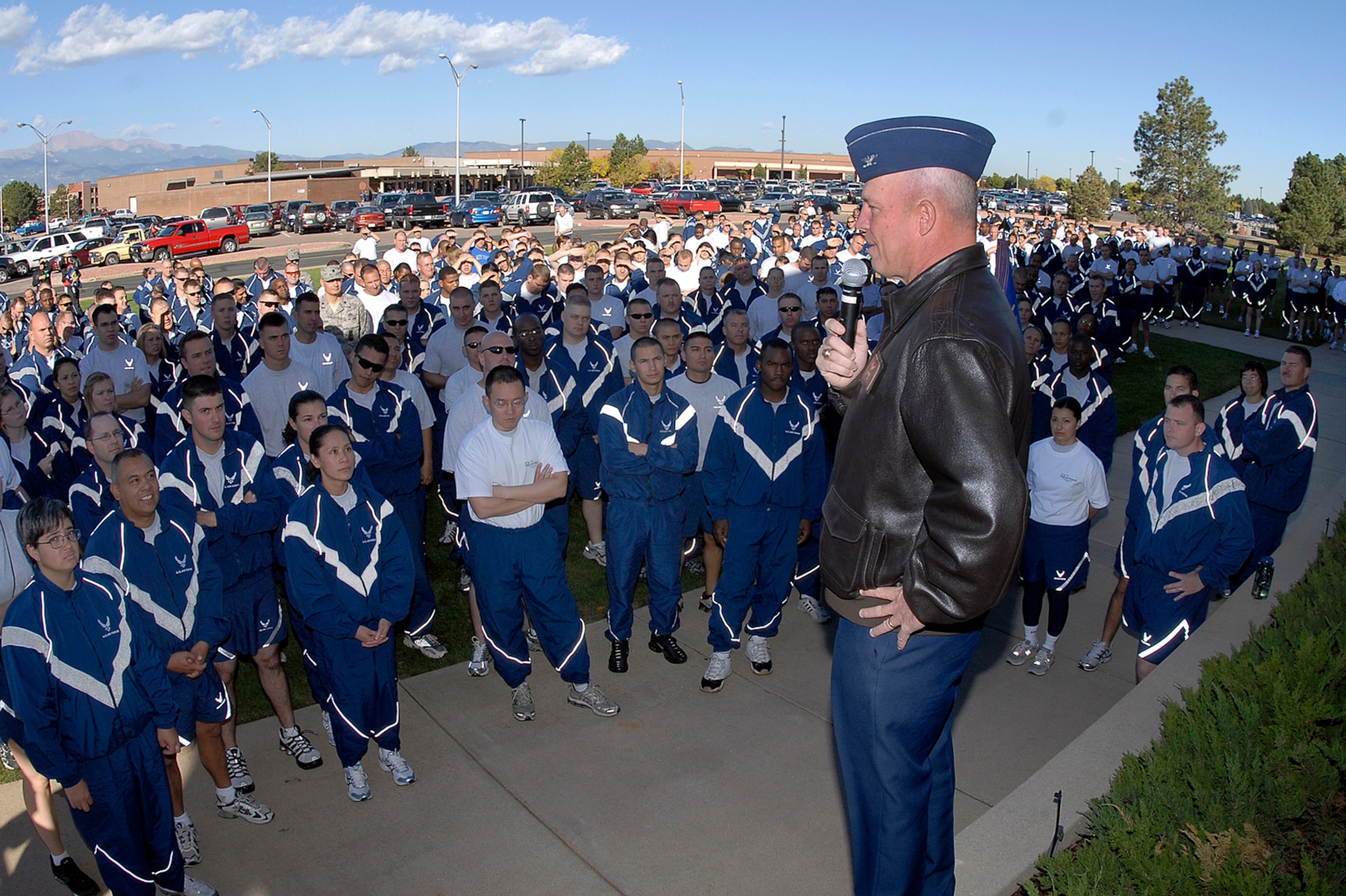 The 21st Space Wwing Commander Col. Jay Raymond talks to the Airmen and civilian team members prior to the physical portion of Oct. 10's Wingman Day.  Col. Raymond stressed the importance of keeping an eye out for your fellow Airmen and their families; being a caring individual who is ready to provide support to any Airman who may need it. The Air Force established the Wingman program to encourage Airmen and their families to look out for each other and to intervene when signs of stress are observed. It's a promise, a pledge, a commitment between Airmen. (Air Force photo/Rob Bussard)