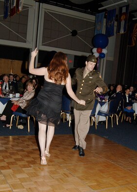 MCCONNELL AIR FORCE BASE, Kan. -- Tabatha Dossett and Dan Carro, from a local dance studio, perform the waltz, foxtrot, Argentine tango and swing during the Air Force Ball’s historical vignettes, Oct. 10. (Photo by Airman 1st Class Maria Ruiz)