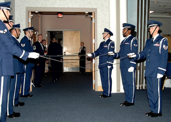 MCCONNELL AIR FORCE BASE, Kan. -- McConnell’s base honor guard form the sabre arch for the guests arriving at the entrance of the Air Force Ball, Oct. 10. (Photo by Airman 1st Class Maria Ruiz)