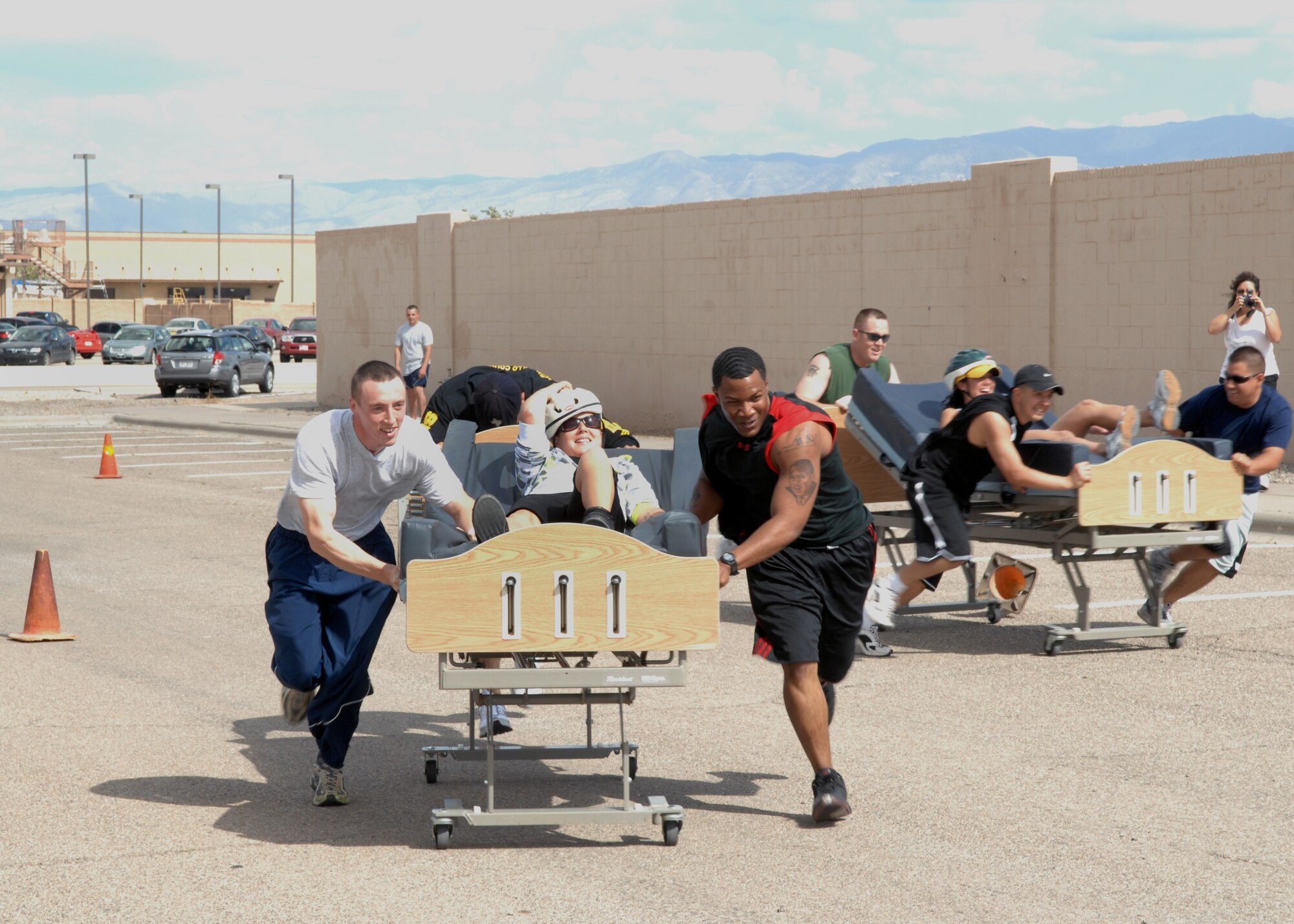 49th Security Forces Squadron team members lead the bed race against the 49th Materiel Maintenance Support Squadron team at Holloman Air Force Base, N.M., October 10. More than 2,000 Airmen from all squadrons come out to participate in Sport Day activities. (U.S. Air Force photo/Airman 1st Class Veronica Salgado) 