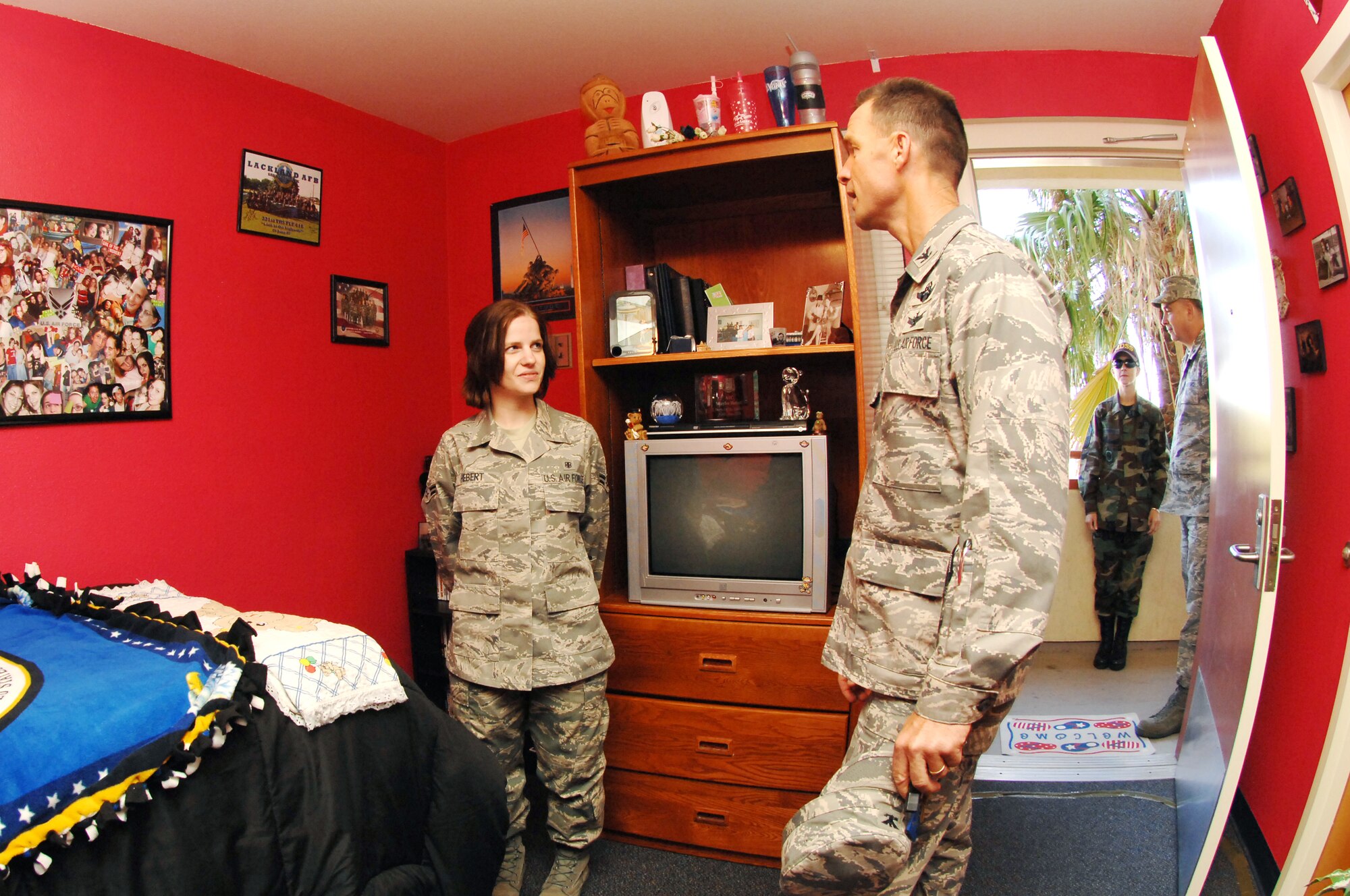 Col. Mark Dillon, 60th Air Mobility Wing commander, inspects the dorm room of Airman 1st Class Shaylee Hebert, 60th Medical Support Squadron Oct. 9. Dorm room inspections are conducted periodically to highlight Airmen that take pride in and keep the rooms in good condition. (U.S. Air Force photo/Amanda Lopez)