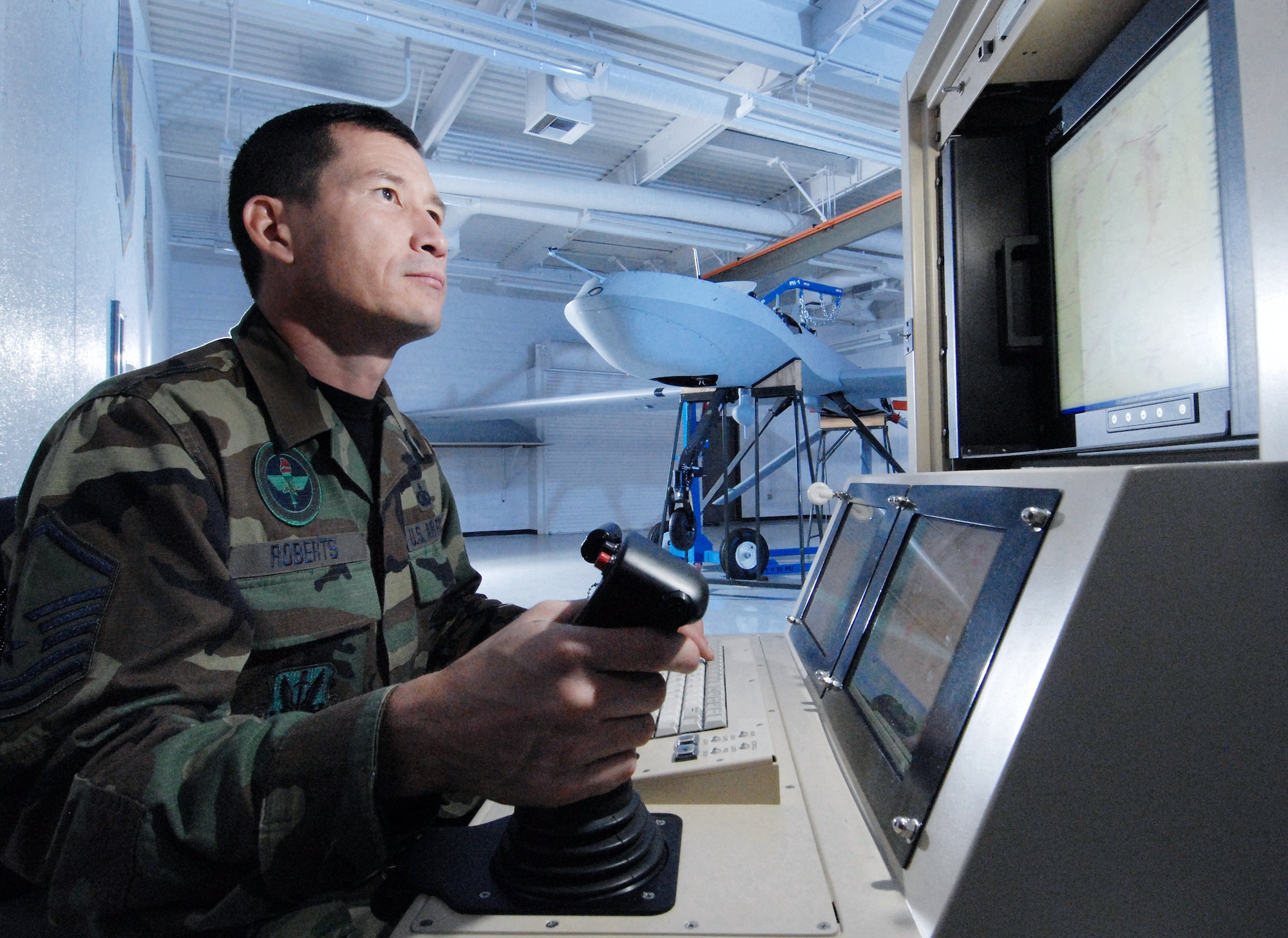 Master Sgt. Fred Roberts, an instructor with Field Training Detachment 26 of the California Air National Guard's 163rd Maintenance Group, uses a maintenance interface station Oct. 15 to check an MQ-1 Predator unmanned aircraft at March Air Reserve Base, Calif.  Airmen with Det. 26 train active duty, Reserve and Air National Guard personnel on Predator maintenance operations. (U.S. Air Force photo/Val Gempis)