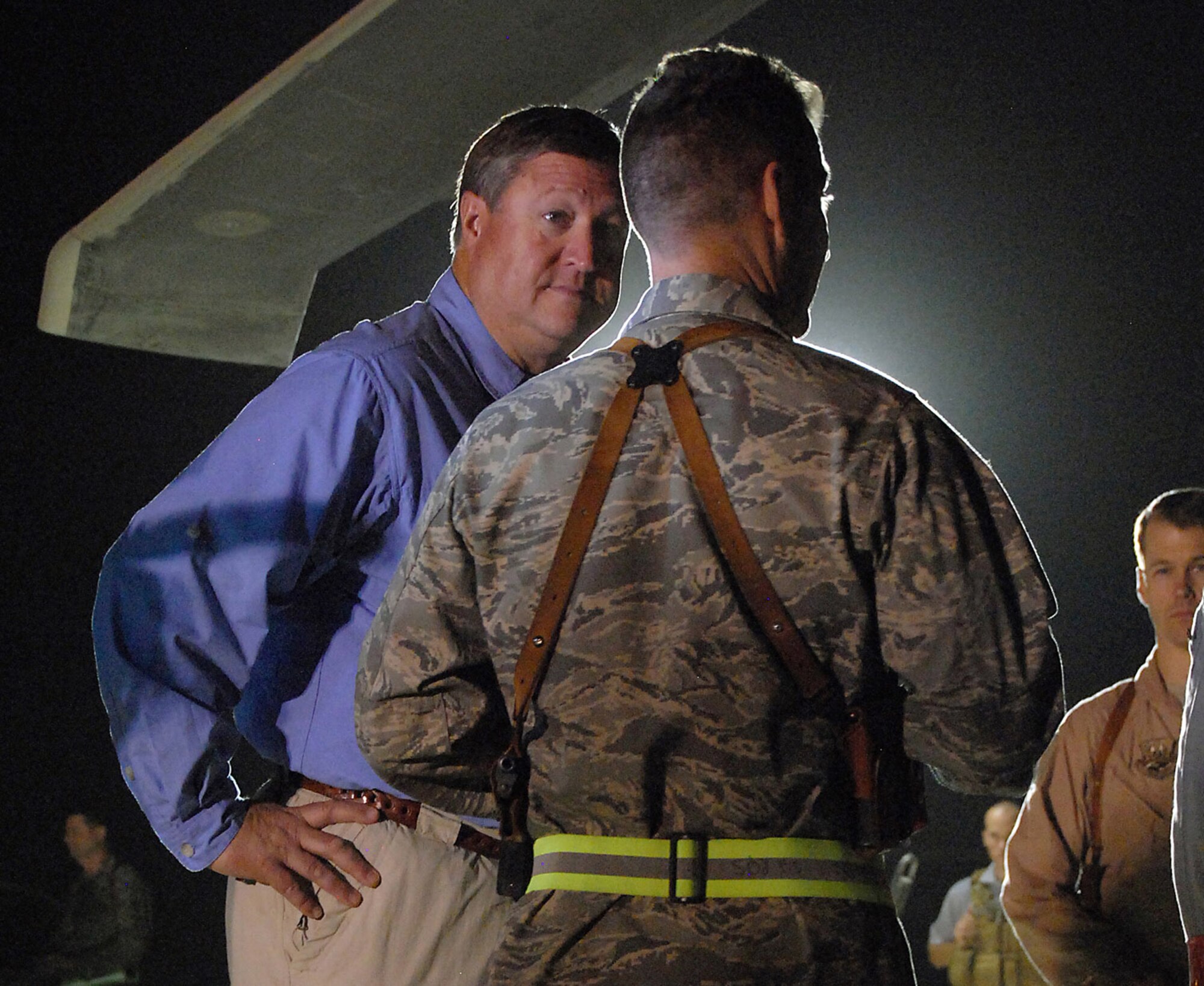Secretary of the Air Force Michael B. Donley and Lt. Col. Chad Franks talk about the 332nd Air Expeditionary Wing's combat search and rescue capabilities Oct. 13 at Joint Base Balad, Iraq. Colonel Franks is the 66th Expeditionary Rescue Squadron commander and is deployed from Nellis Air Force Base, Nev. (U.S. Air Force photo/Staff Sgt. Don Branum)
