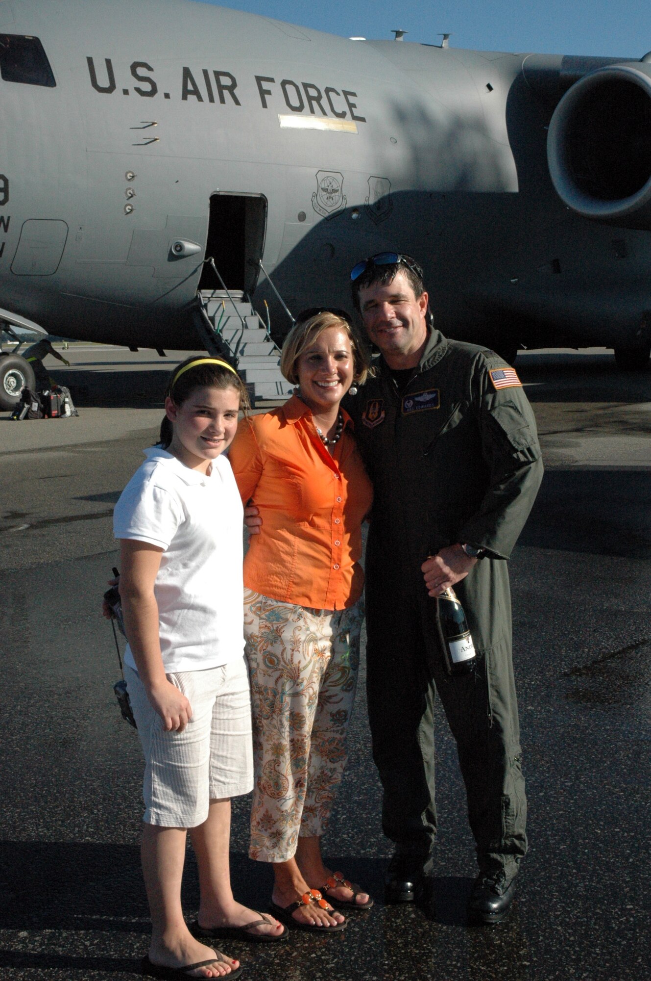 Operations Group Commander Colonel Bill Edwards poses with his wife Faith and daughter Erin after his final flight on October 14, 2008.  Col. Edwards will be leaving his position as Operations Group Commander and transitioning to a new position within the wing. (U.S. Air Force photo/Tech. Sgt. Jeff Kelly)