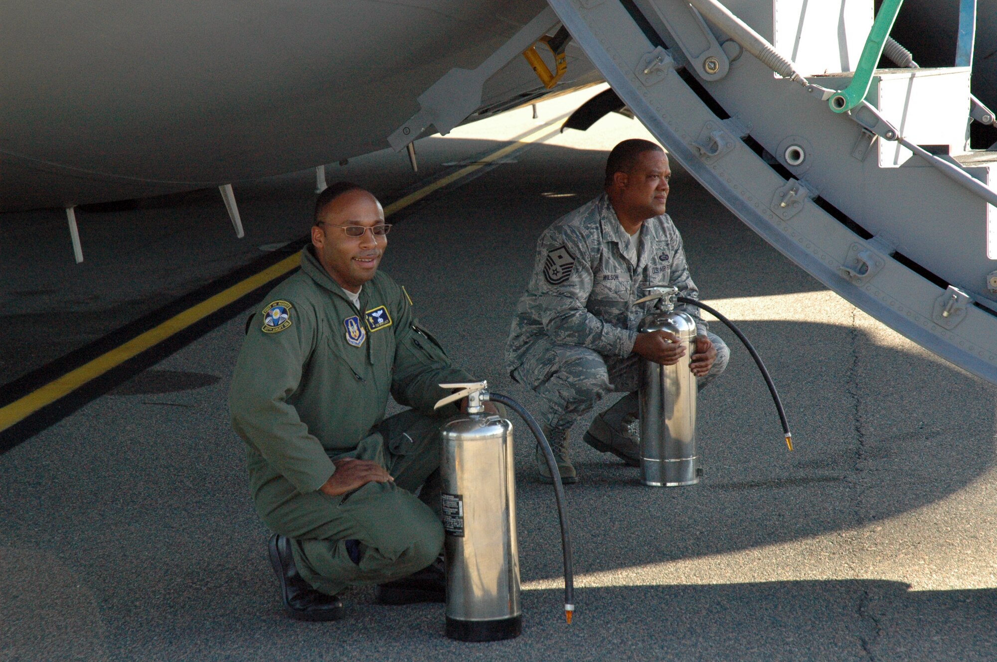 Members of the 315th Airlift Wing prepare to ambush outgoing 315th AW Operations Group Commander Colonel Bill Edwards with water after his final flight on October 14, 2008.  Col. Edwards will be leaving his position as Operations Group Commander and transitioning to a new position within the wing. (U.S. Air Force photo/Tech. Sgt. Jeff Kelly) 