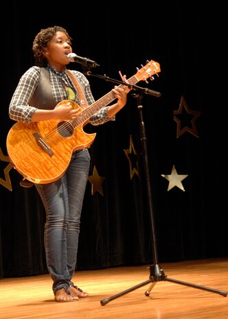 Faith Davis performs during the Charleston AFB Family and Teen Talent Contest at the base theater Oct. 9. Faith won the 16-18-year-old solo act portion of the contest. Faith is the daughter of Lillie and retired Chief Master Sgt. Reggie Davis. (U.S. Air Force photo/Airman 1st Class Katie Gieratz)