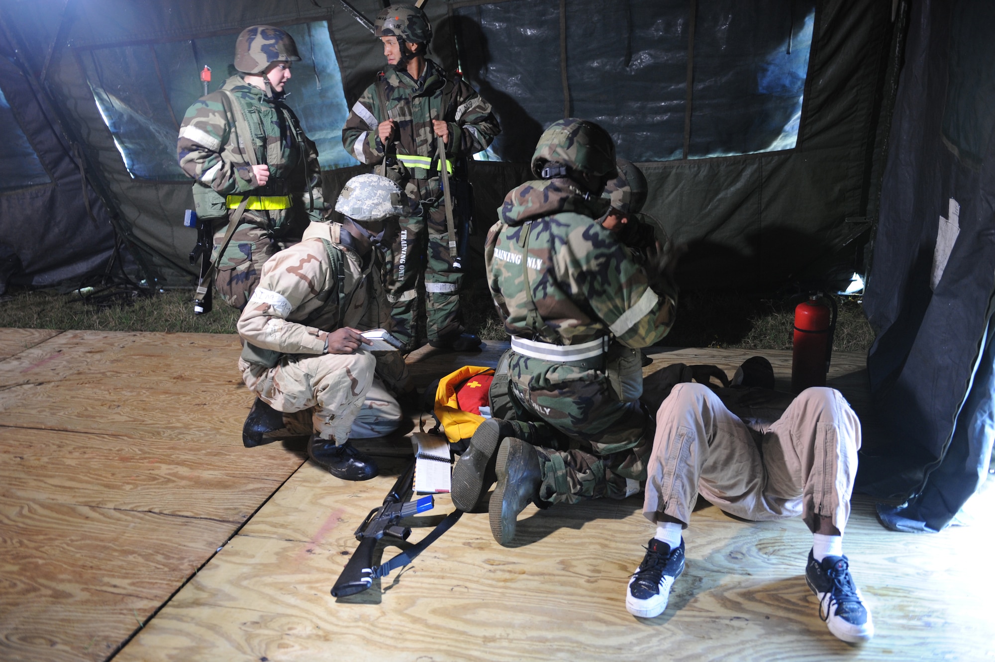 SHAW AIR FORCE BASE, S.C. -- Airmen from the 20th Civil Engineer Squadron provide first aid to an injured insurgent during a Phase II Operational Readiness Exercise Oct. 15. OREs test and evaluate deployment readiness. (U.S. Air Force photo/Staff Sgt. Henry Hoegen)