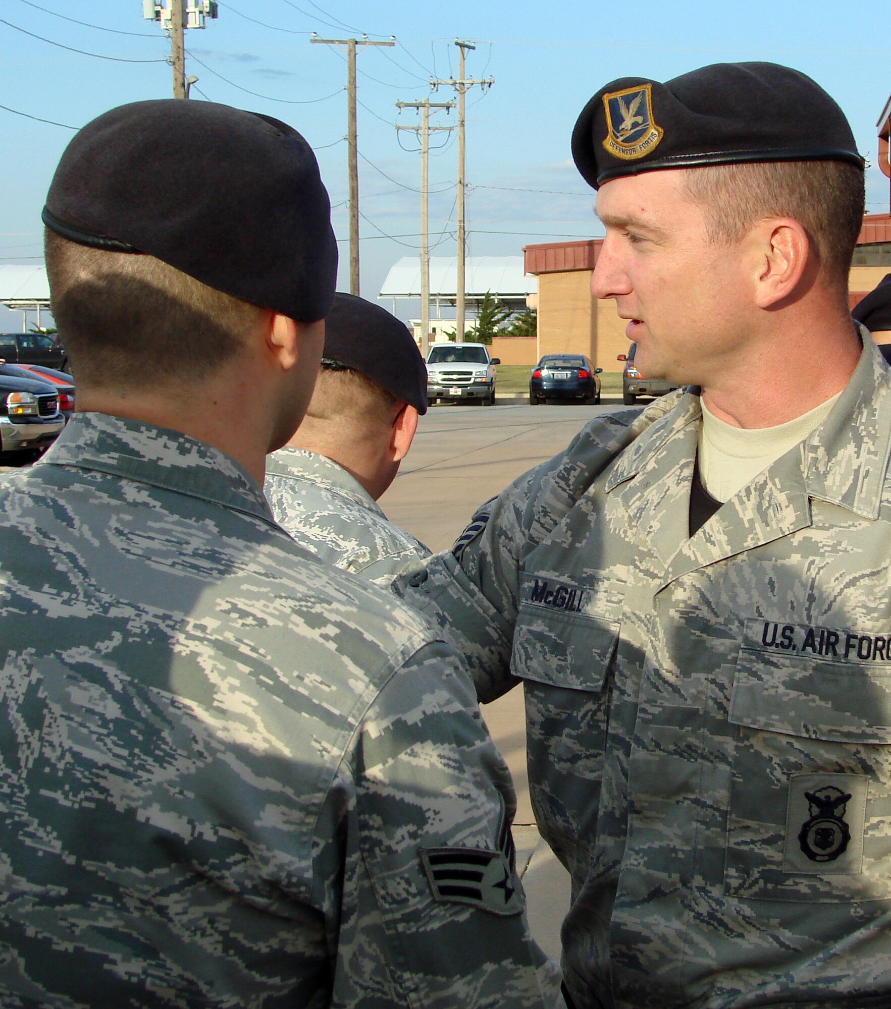 Tech. Sgt. Jeremy McGill is congratulated by his now “fellow” Security Forces members after being awarded his Security Forces badge during a ceremony outside the 71st Security Forces Squadron Friday, Oct. 10, at Vance AFB. (U.S. Air Force photo by Joe B. Wiles)
