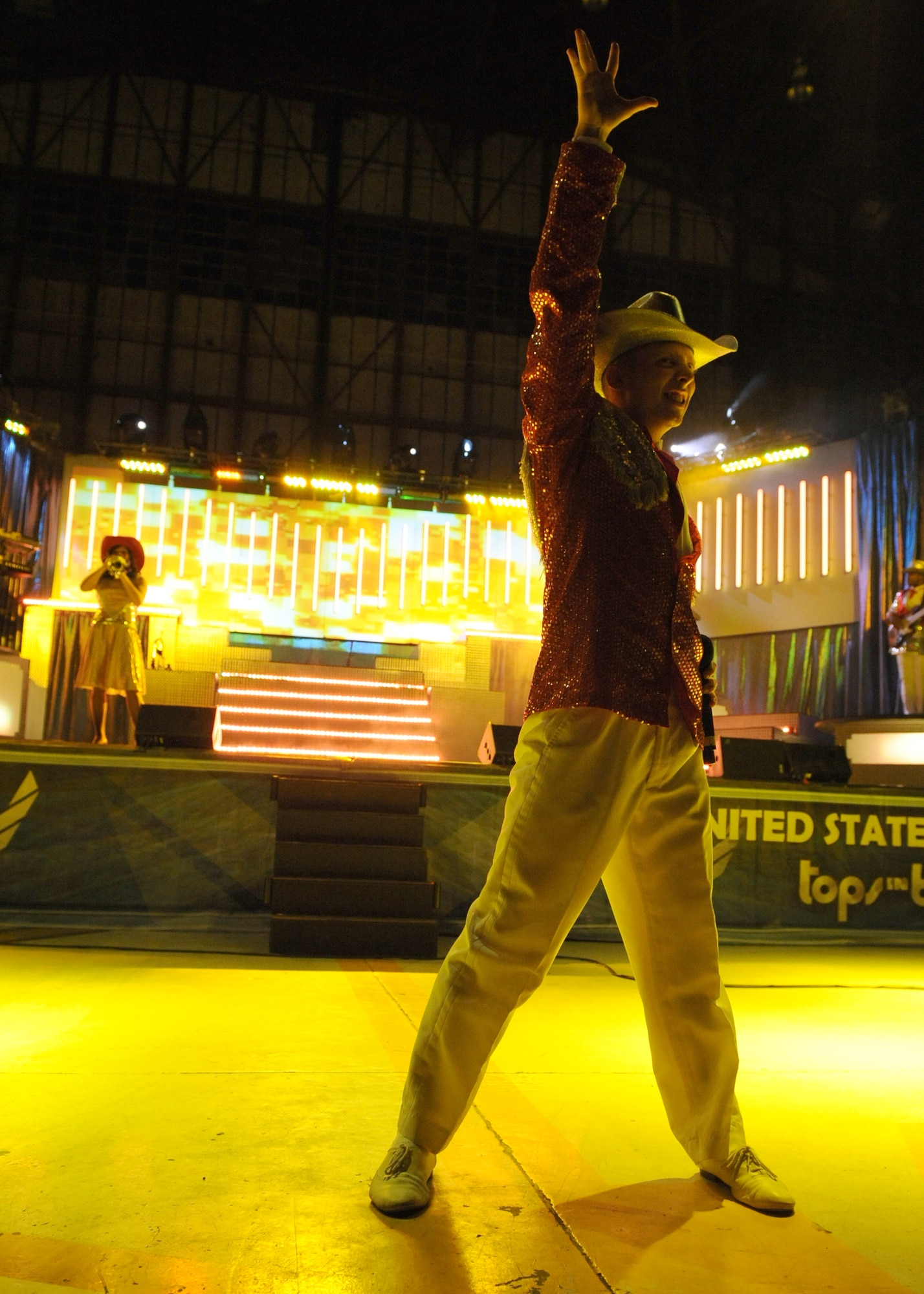An Airman closes out extraordinary performance with Tops in Blue here at Seymour Johnson Air Force Base, N.C. on Oct. 14, 2008. Tops in Blue are a combined group of 35 entertainers (singers and musicians) that travel to Air Force Bases worldwide to perform for servicemembers. (U. S. Air Force photo by Airman 1st Class Whitney Stanfield)
