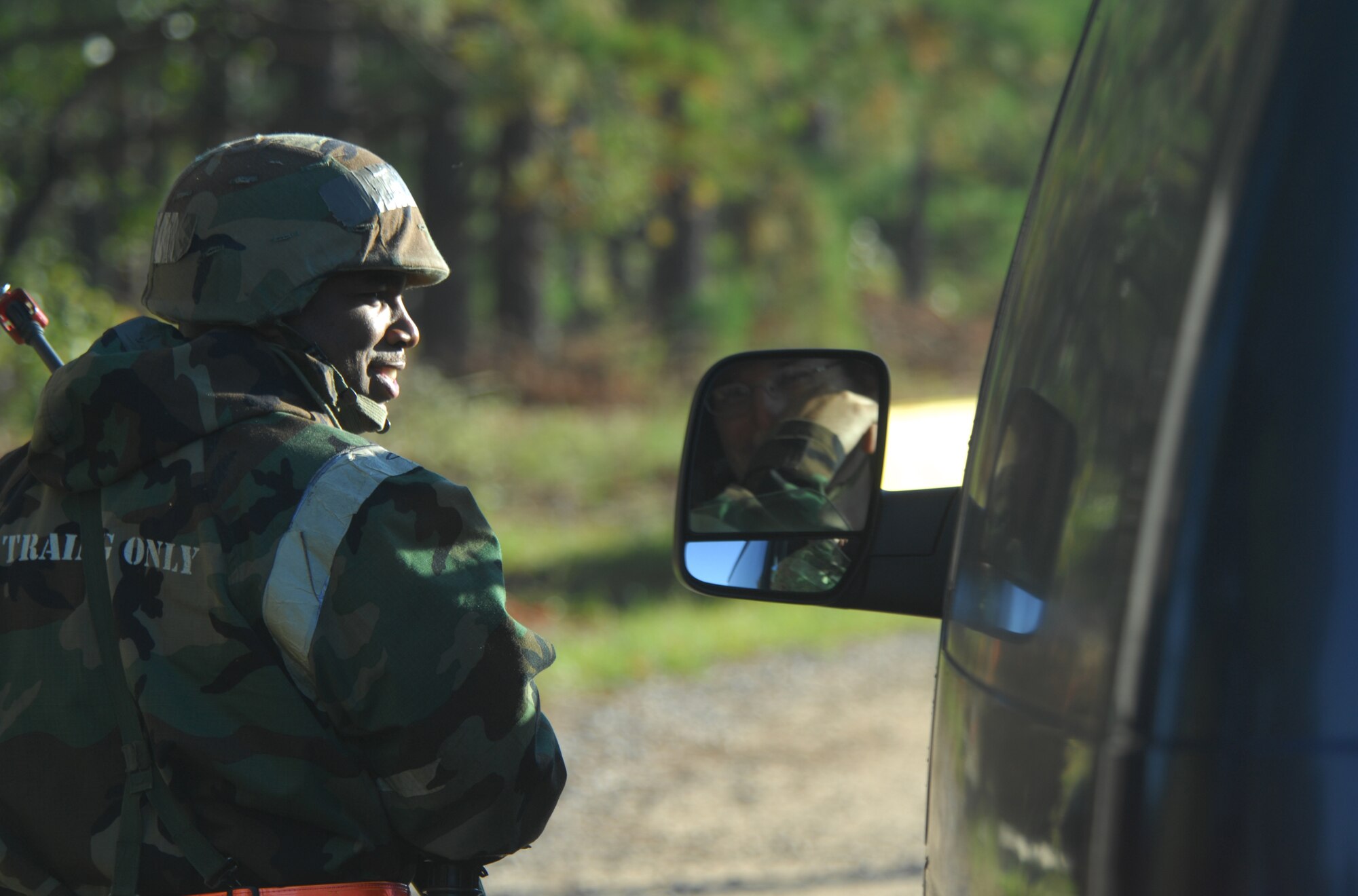 SHAW AIR FORCE BASE, S.C. -- Staff Sgt. Kewana Williams, 20th Civil Engineer Squadron heating ventilation air condition craftsman, confirms the sign and counter-sign before letting a vehicle enter the CE compound during a Phase II Operational Readiness Exercise Oct. 15. OREs help prepare and evaluate Airmen for real-world deployment. (U.S. Air Force photo/Staff Sgt. Patrick Mitchell)