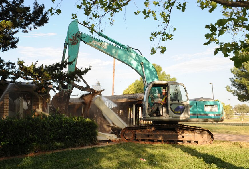DYESS AIR FORCE BASE, Texas -- Colonel Robert Gass, 7th Bomb Wing commander, tears down the previously designated wing commanders house here, Oct. 10.  This house is one of the last of the old base houses to be demolished.  Dyess AFB has replaced the old housing units with new homes to meet new standards and improve quality of life for our Airmen.  (U.S. Air Force photo/Staff Sergeant Darcie Ibidapo)