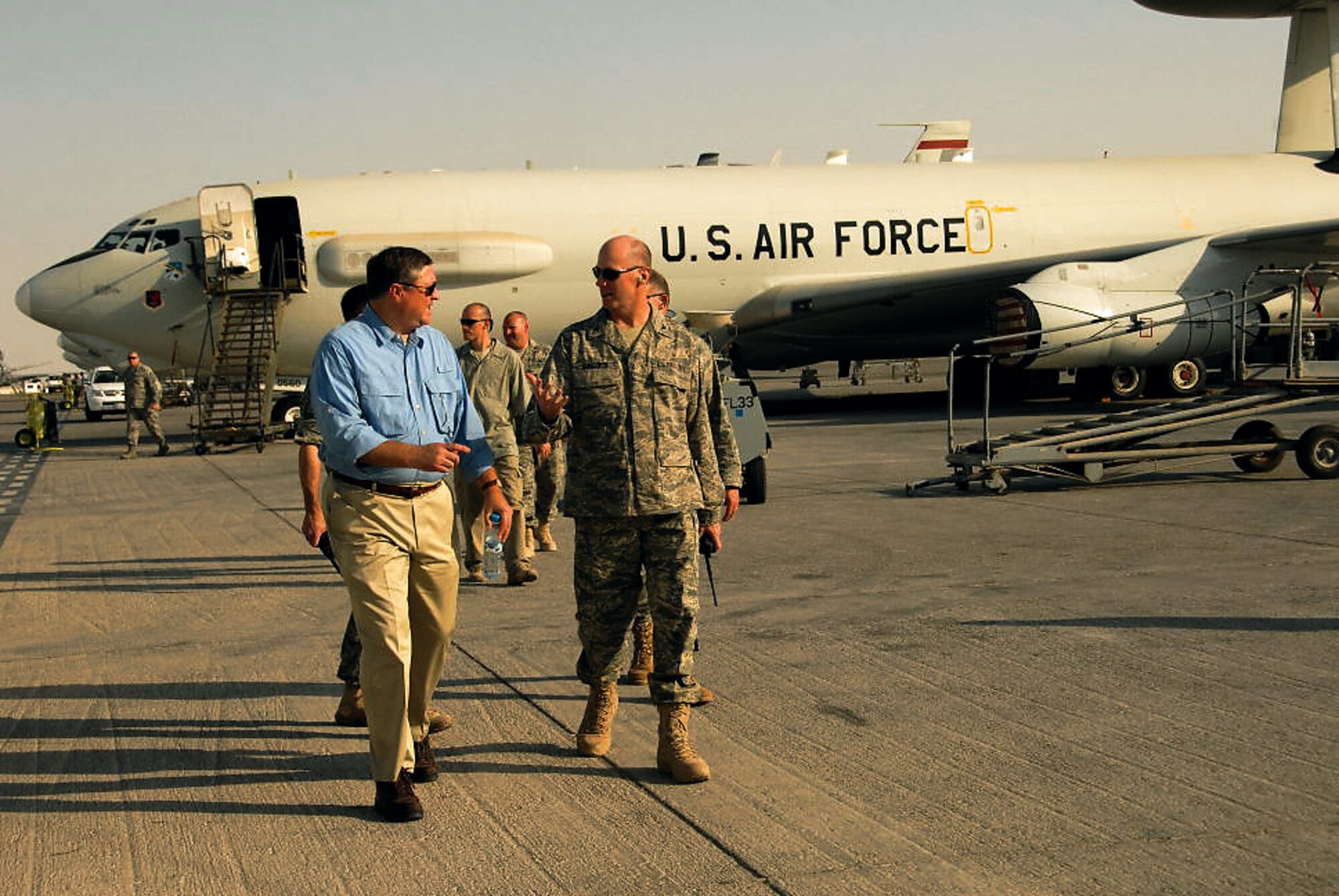 Secretary of the Air Force Michael B. Donley speaks to the 380th Expeditionary Group Commander Col. Raymond Corcoran at an air base in Southwest Asia Oct. 12. The secretary visited the 380th Air Expeditionary Wing to gain a better understanding of the infrastructure and capabilities of one the smallest but most diverse bases in the Air Forces Central area of responsibility. (U.S. Air Force photo/Tech. Sgt. Denise Johnson)