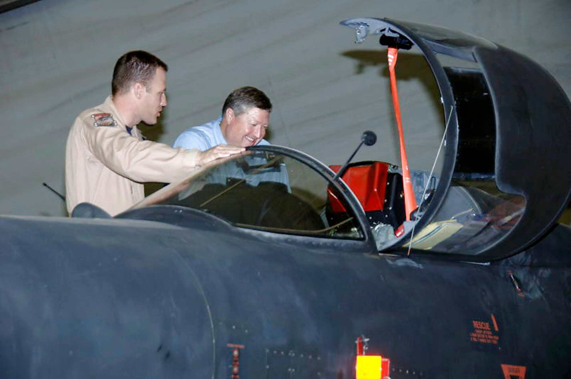 Lt. Col. Vincent Catich shows Secretary of the Air Force Michael B. Donley the cockpit of a U-2 Dragonlady during the secretary's visit to the 380th Air Expeditionary Wing at an air base in Southwest Asia Oct. 12. The secretary visited the 380th Air Expeditionary Wing to gain a better understanding of the infrastructure and capabilities of one the smallest but most diverse bases in the Air Forces Central area of responsibility. (U.S. Air Force photo/Tech. Sgt. Christopher A. Campbell)