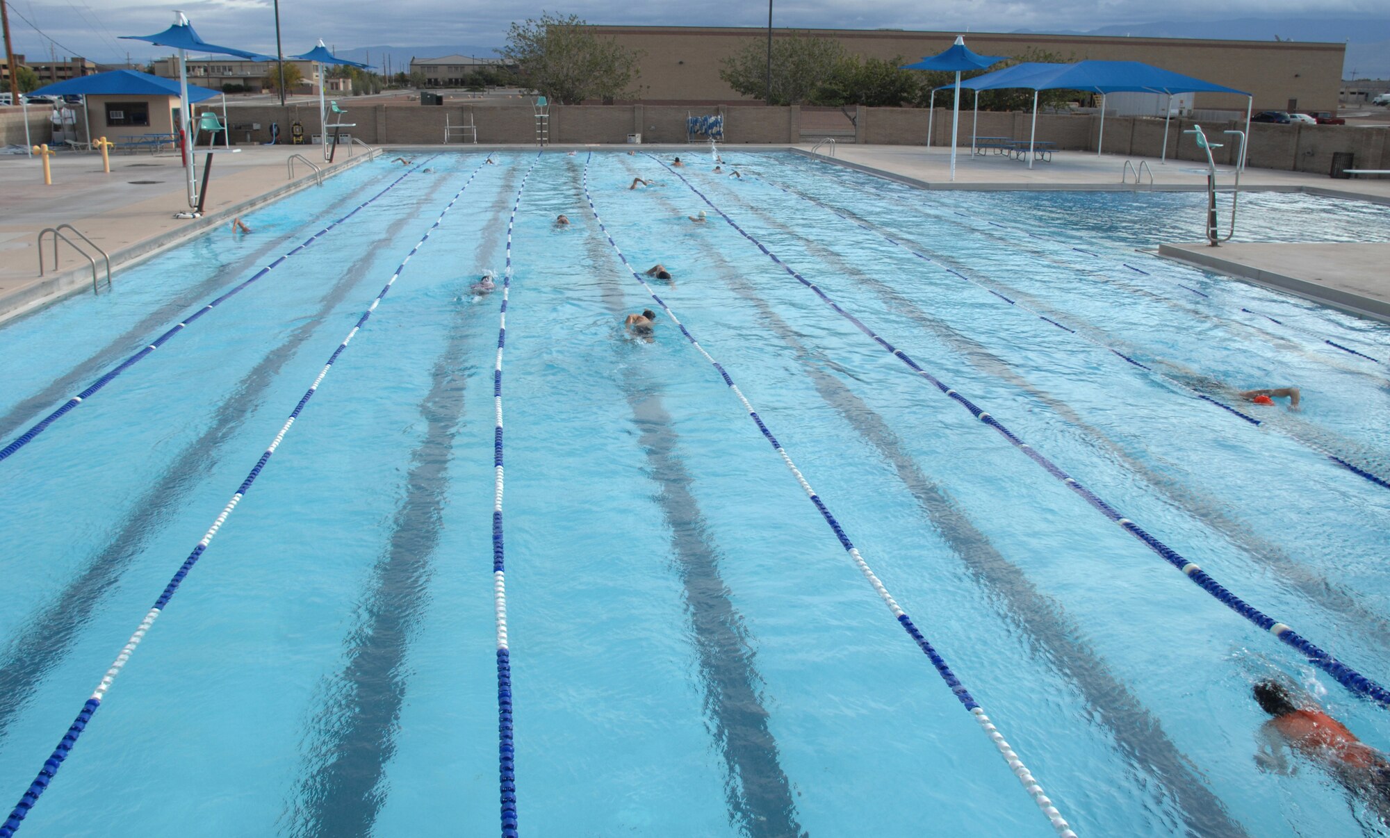 Athletes swim 700 meters in the Aquatic Center pool before completing the annual Triathlon at Holloman Air Force Base, N.M., October 21. The Triathlon was open to everyone who signed up and more than 60 athletes participated. (U.S. Air Force photo/Airman Sondra M. Escutia)