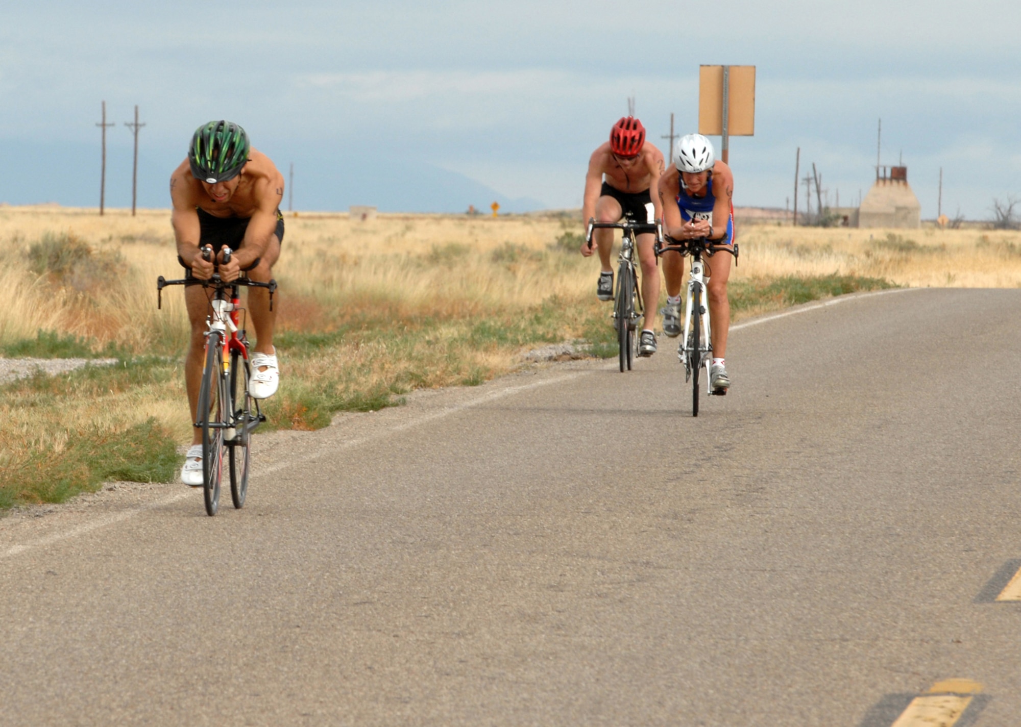 Athletes participating in the annual Triathlon bike 30K after a 5K run at Holloman Air Force Base, N.M., October 12. The Triathlon was open to everyone who signed up and more than 60 athletes participated. (U.S. Air Force photo/Airman Sondra M. Escutia)
