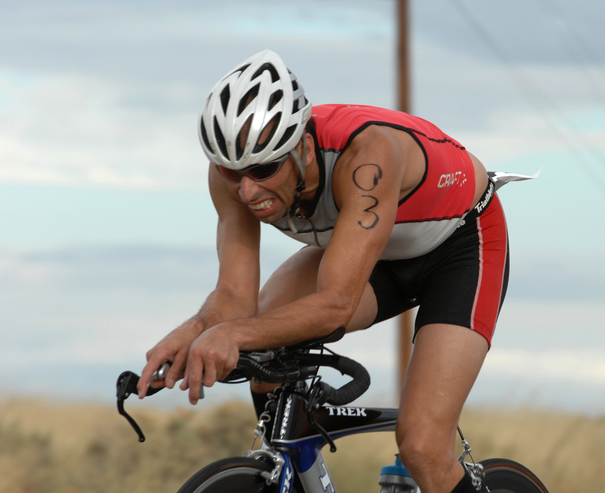 Bobby Gonzales, a tri-athlete from El Paso, Texas, rides his bike in the 30K ride during the annual Triathlon at Holloman Air Force Base, N.M., October 12. Mr. Gonzales won the overall Triathlon with a time of one hour and 26 seconds.  (U.S. Air Force photo/Airman Sondra M. Escutia)