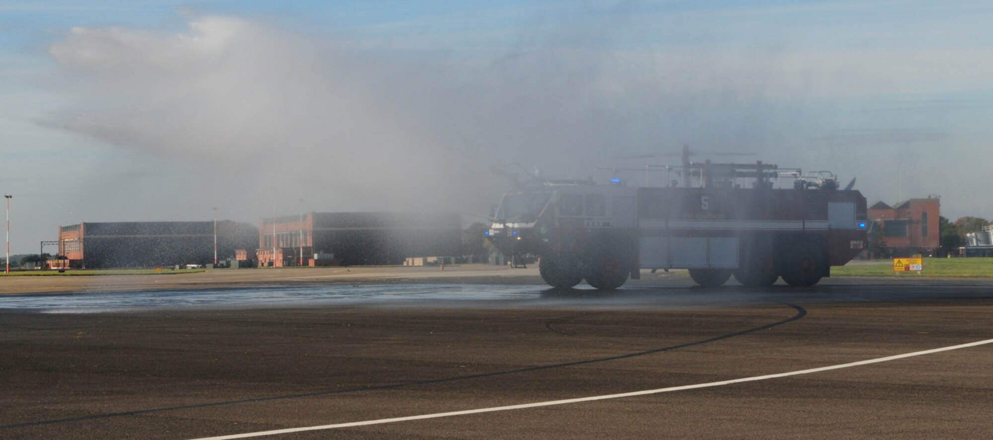 Firefighters demonstrated some of the capabilities of their new Striker fire truck at the 100th Civil Engineer Squadron Fire Department's open house Oct. 11. (U.S. Air Force photo by Karen Abeyasekere)