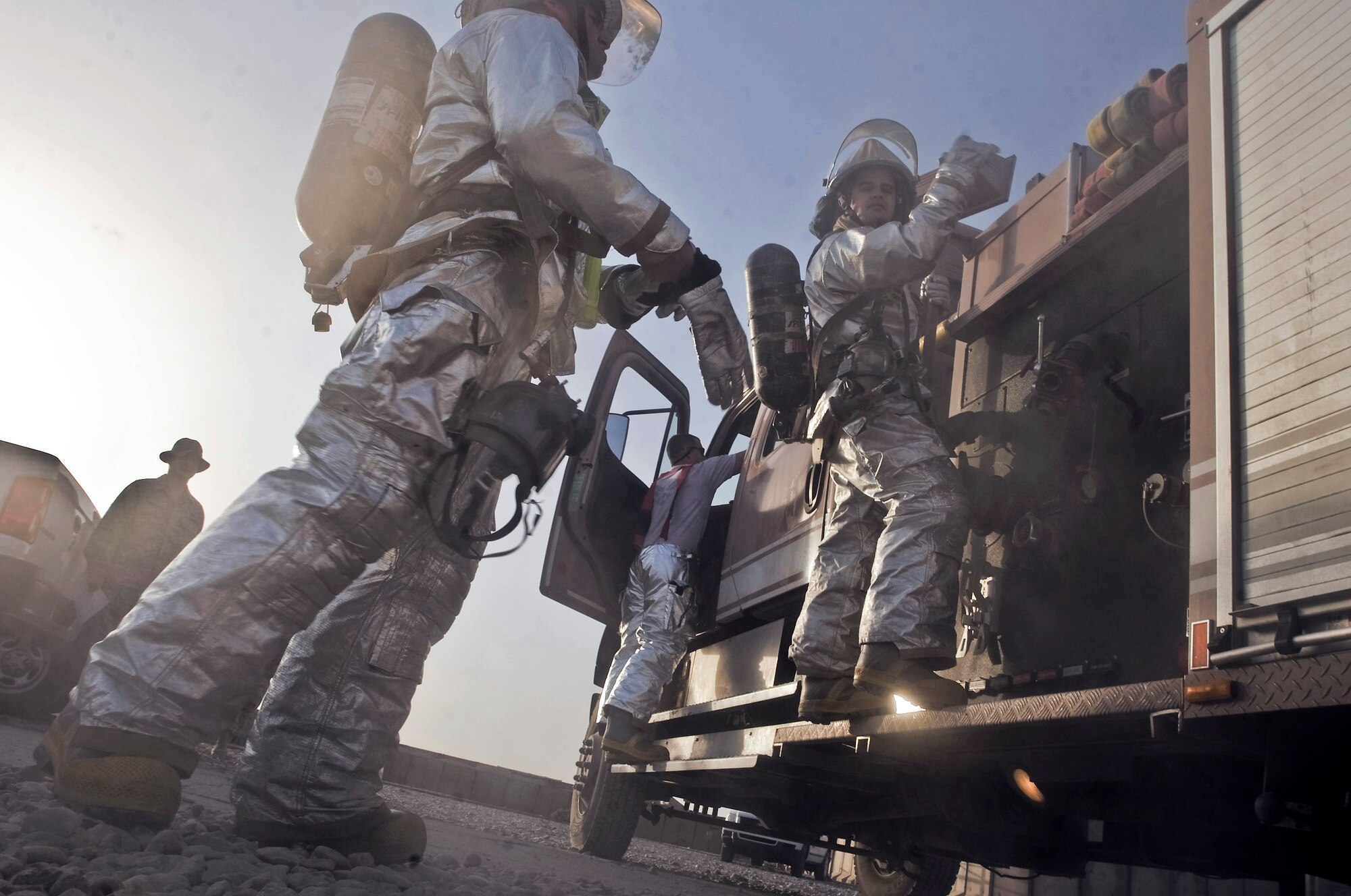 Firefighters with the 407th Expeditionary Civil Engineer Squadron respond to a training exercise Oct. 3 at Ali Base, Iraq. They conducted the training at the passenger terminal to evaluate aspects of fire protection such as dispatch and response. (U.S. Air Force photo/Airman 1st Class Christopher Griffin) 
