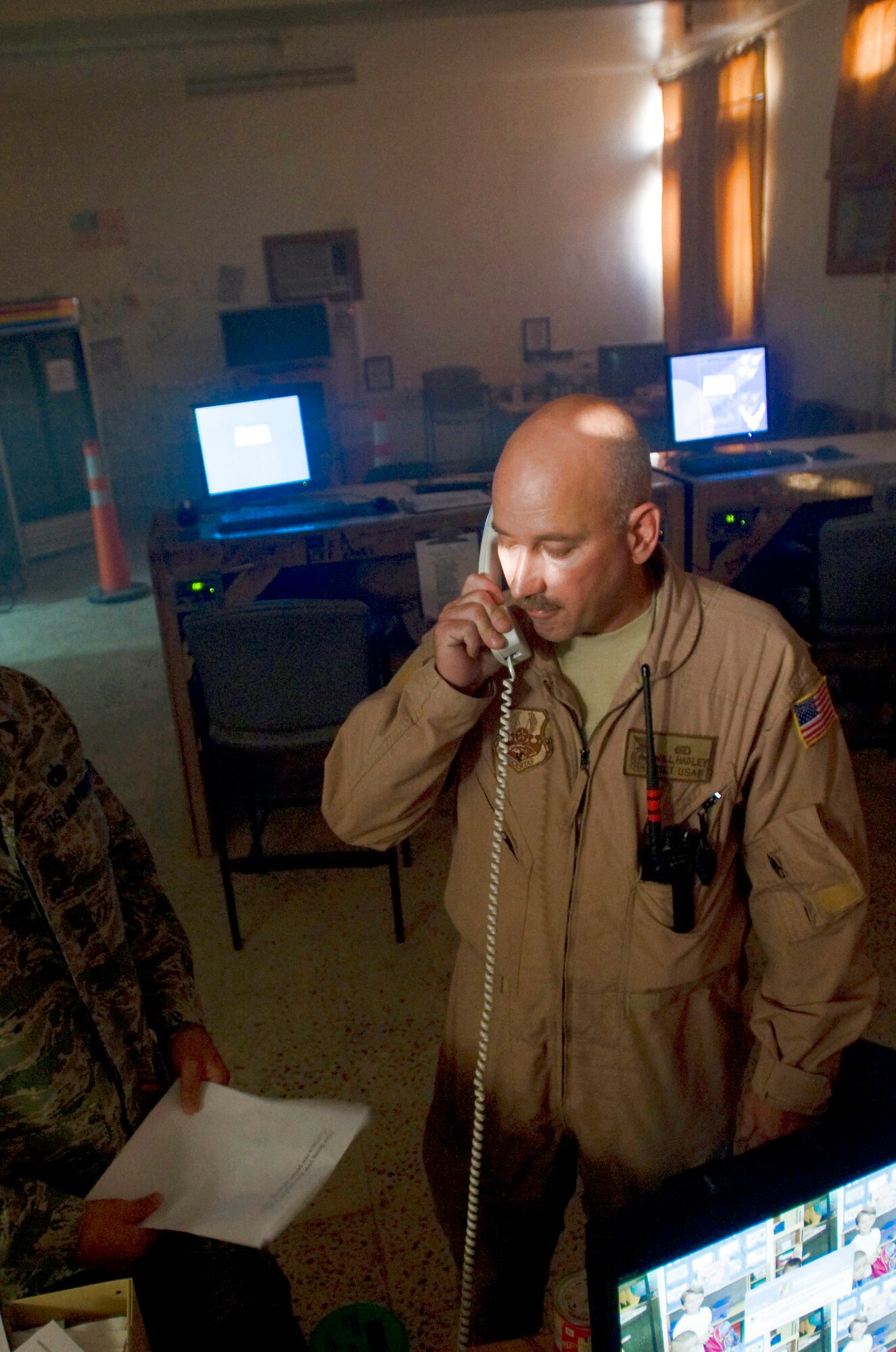 Master Sgt. William Hadley Jr. calls in a simulated fire in the passenger terminal Oct. 3 at Ali Base, Iraq. The 407th Expeditionary Civil Engineer Squadron's fire department held a structural drill to evaluate its response to a fire alert. Sergeant Hadley, the assistant chief of training for the 407th ECES, is deployed from Eglin Air Force Base, Fla. (U.S. Air Force photo/Airman 1st Class Christopher Griffin) 
