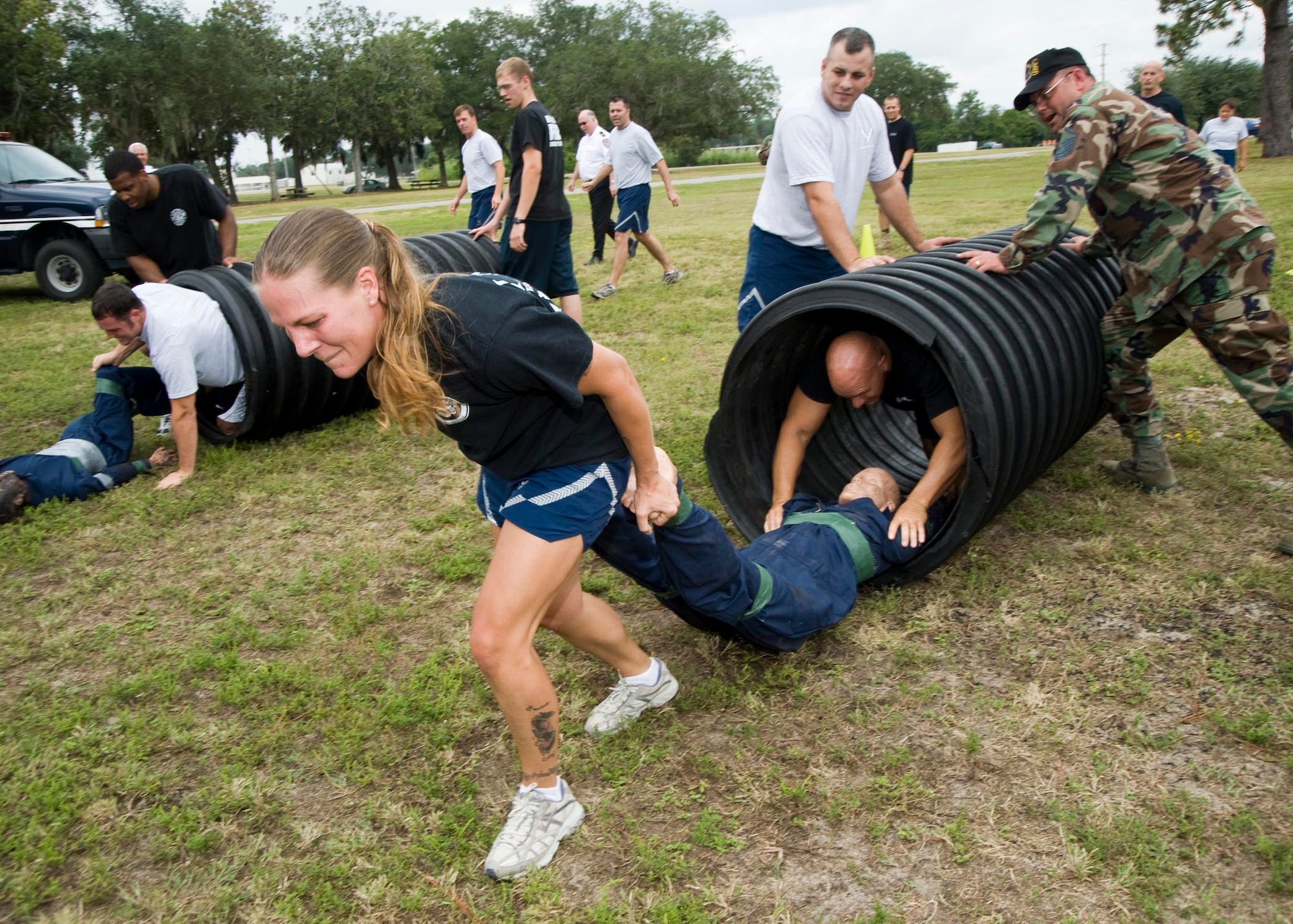 Teams perform a "victim"  carry during the first Fire Muster Challenge Oct. 10. The challenge was one of the activities to highlight Fire Prevention Week.  (USAF photo by Bruce Hoffman)