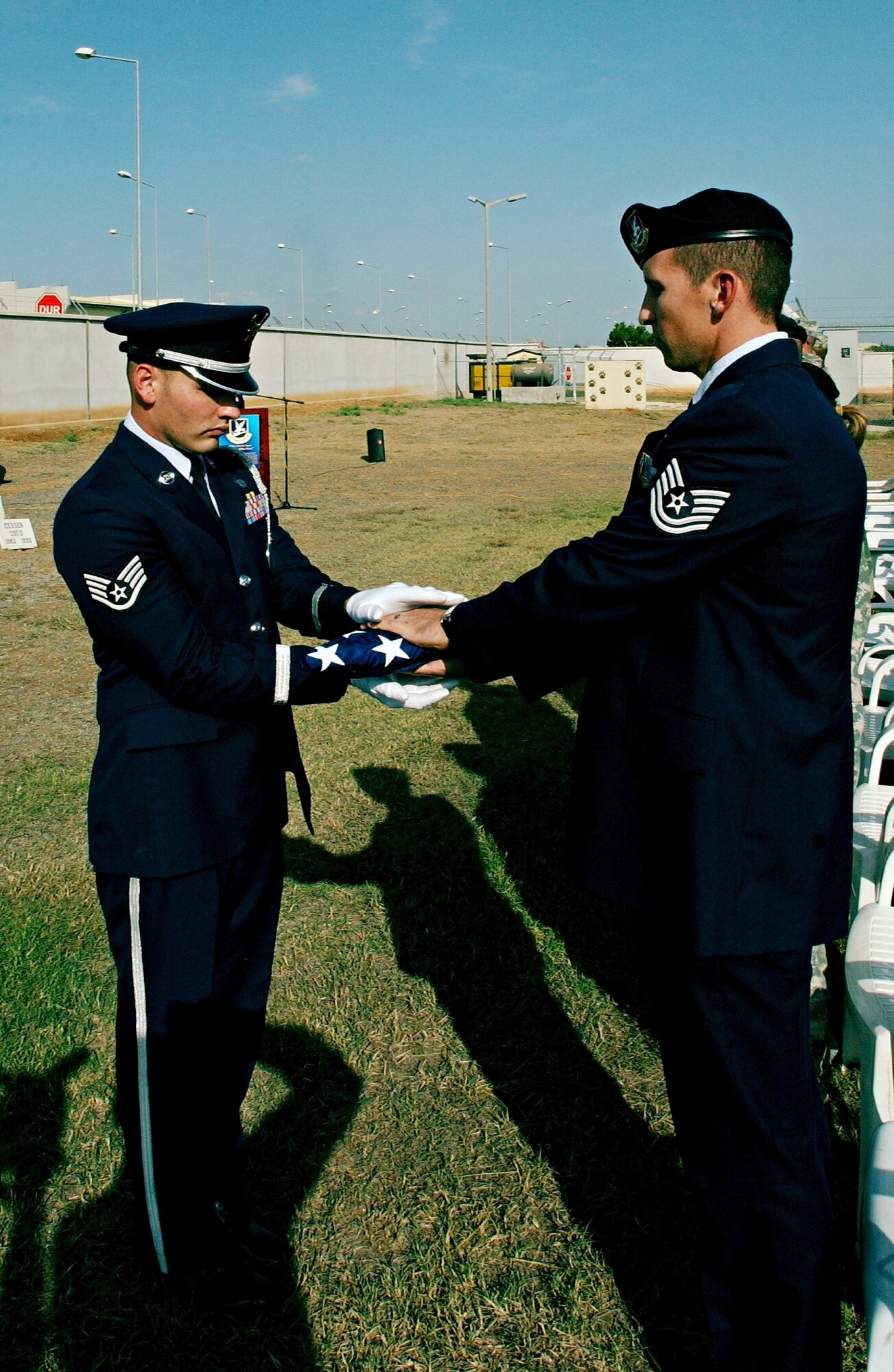 39 Air Base Wing honor guard presents a folded American flag to Tech Sgt. Alan Frank, 39 SFS kennel master, in memory of his deceased military working dog, Rocky, who lost his battle with cancer earlier this month.