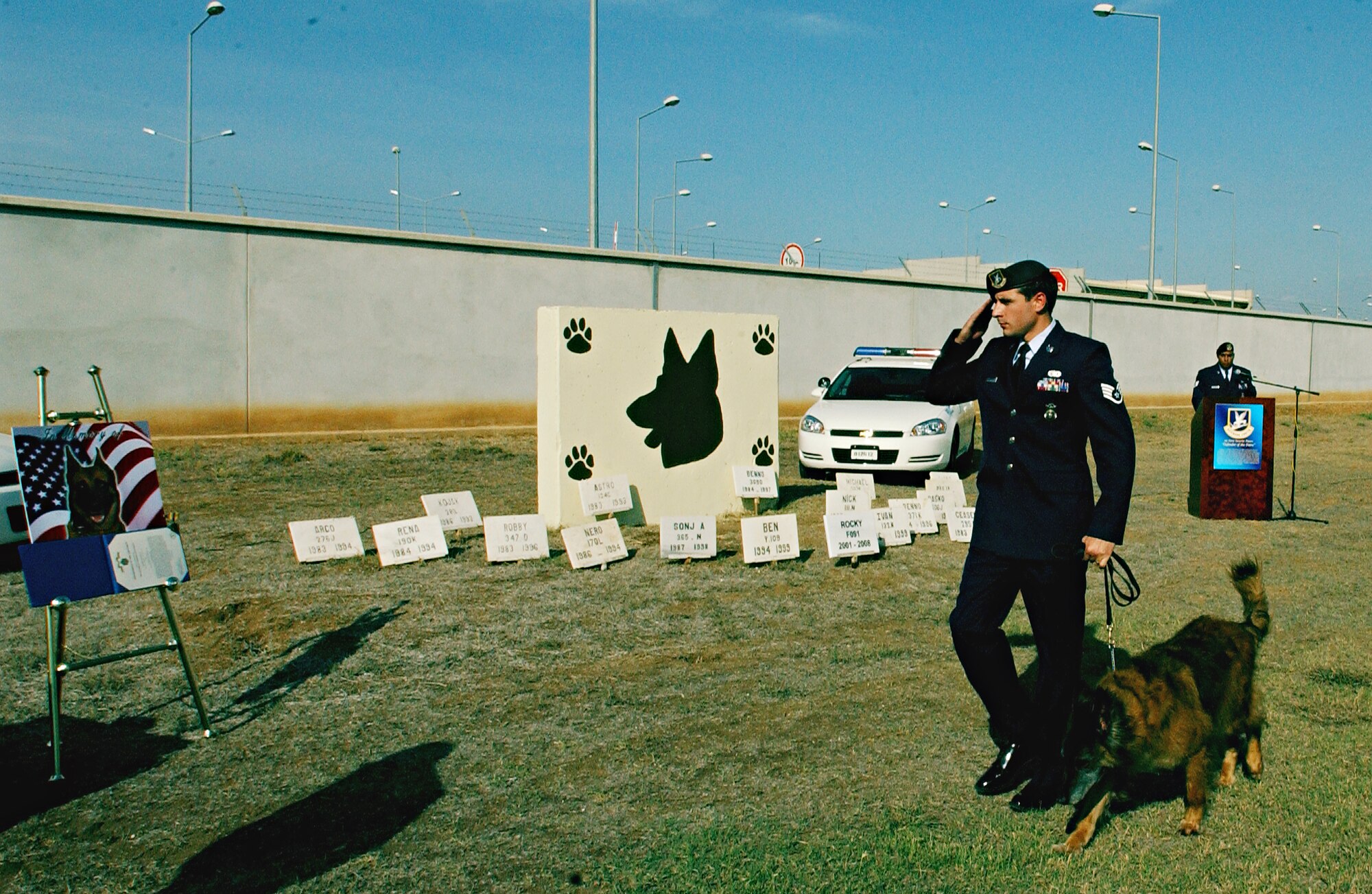 Staff Sgt. Clayton Carter, 39 SFS MWD handler, and MWD, Arad, render a salute to Rocky’s memorial. Rocky worked as a MWD at Incirlik for over four years and was awarded an accommodation medal.