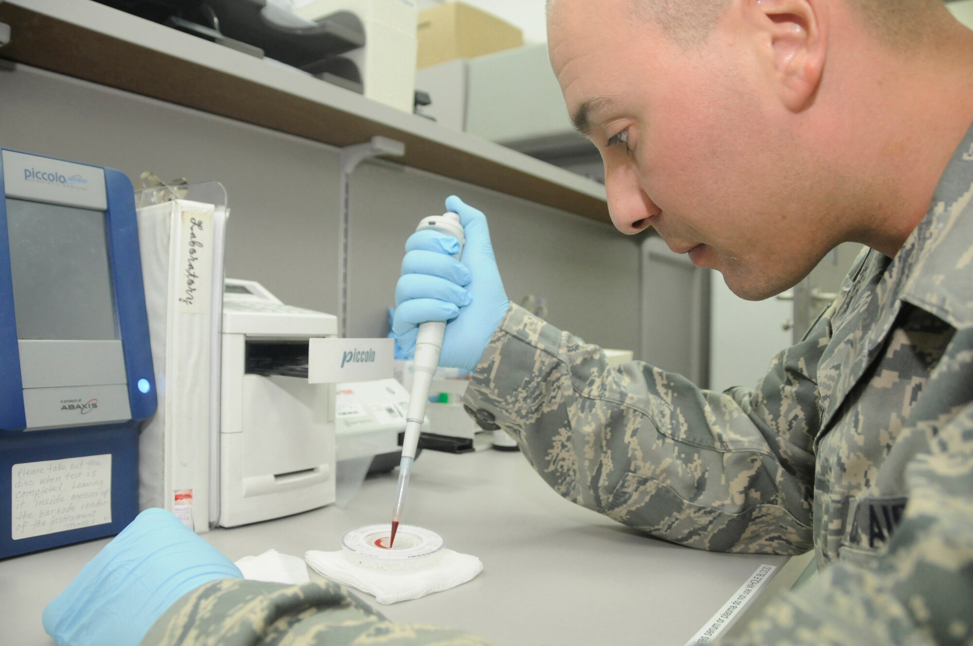 Tech Sgt. Vincent Bisignano, a laboratory technician assigned to the 379th Expeditionary Medical Group, uses a pipette to drop blood onto a reagent disc so it can be placed in a chemistry analyzer to check electrolytes Oct. 14, 2008, at an undisclosed air base in Southwest Asia. The laboratory technicians here are responsible for pinpointing medical problems so personnel can be treated and returned to their units to continue fighting the global war on terrorism. Sergeant Bisignano, a native of Bronx, N.Y., is deployed from Shaw Air Force Base, S.C., in support of Operations Iraqi and Enduring Freedom and Joint Task Force-Horn of Africa. (U.S. Air Force photo by Staff Sgt. Darnell T. Cannady/Released)
