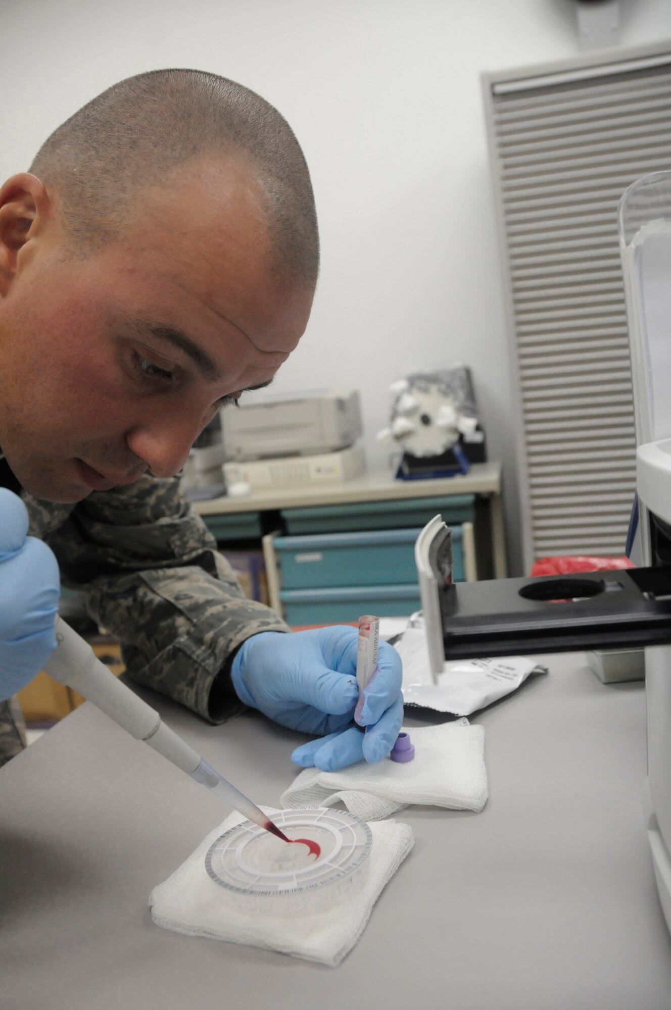 Tech Sgt. Vincent Bisignano, a laboratory technician assigned to the 379th Expeditionary Medical Group, uses a pipette to drop blood onto a reagent disc so it can be placed in a chemistry analyzer to check electrolytes Oct. 14, 2008, at an undisclosed air base in Southwest Asia. The laboratory technicians here are responsible for pinpointing medical problems so personnel can be treated and returned to their units to continue fighting the global war on terrorism. Sergeant Bisignano, a native of Bronx, N.Y., is deployed from Shaw Air Force Base, S.C., in support of Operations Iraqi and Enduring Freedom and Joint Task Force-Horn of Africa. (U.S. Air Force photo by Staff Sgt. Darnell T. Cannady/Released)