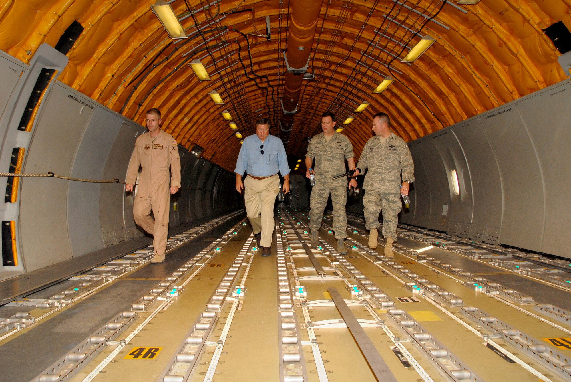 SOUTHWEST ASIA -- Secretary of the Air Force Michael B. Donley gets a tour of a KC-10 Extender from Col. Paul Murphy and  Lt. Col. Joel Jackson here Oct. 12. The Secretary visited the 380th Air Expeditionary Wing to gain a better understanding of the infrastructure and capabilities of one the smallest but most diverse bases in the Area of Responsibility. (U.S. Air Force photo/Tech. Sgt. Denise Johnson)(released)