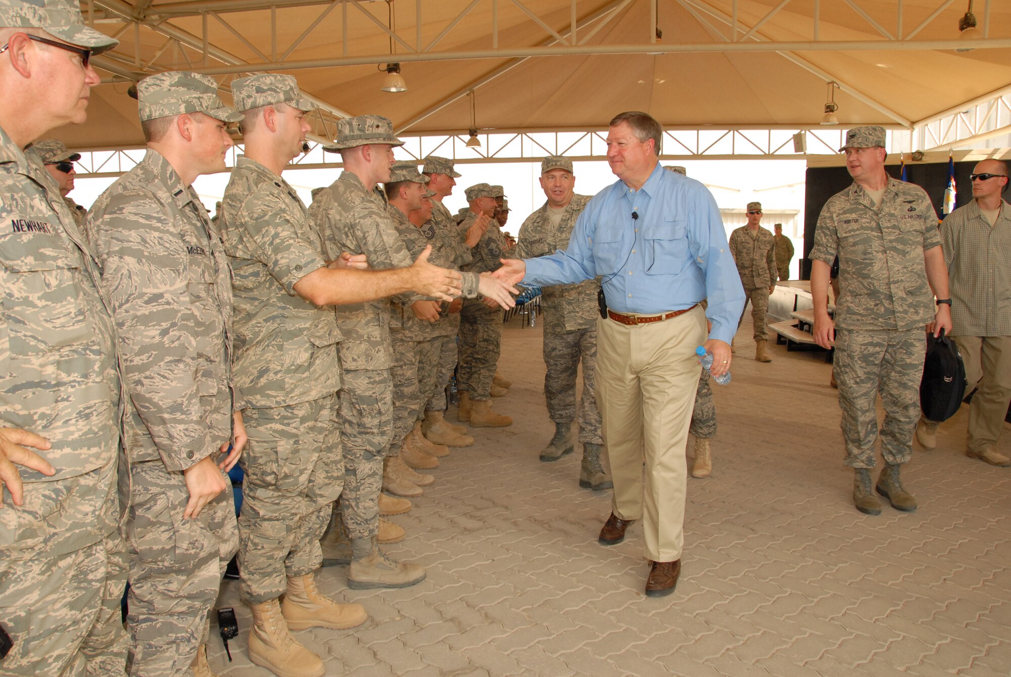 SOUTHWEST ASIA -- Secretary of the Air Force Michael B. Donley shakes the hands of several troops of the 380th Air Expeditionary Wing here Oct. 12. The Secretary visited the 380th Air Expeditionary Wing to gain a better understanding of the infrastructure and capabilities of one the smallest but most diverse bases in the Area of Responsibility. (U.S. Air Force photo/Tech. Sgt. Denise Johnson)(released)