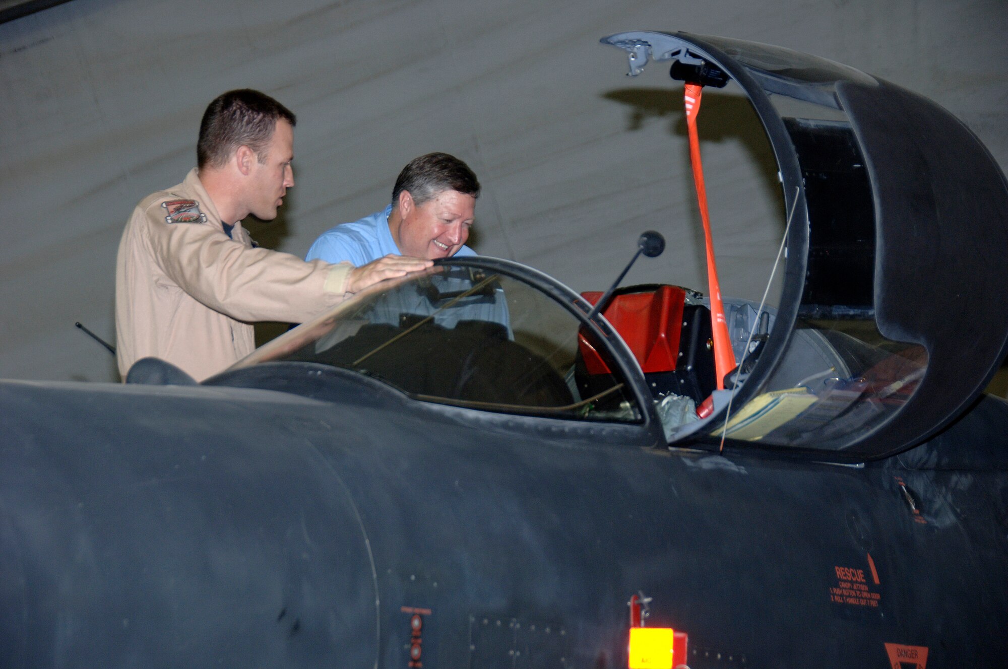 SOUTHWEST ASIA -- Lt. Col. Vincent Catich shows Secretary of the Air Force Michael B. Donley the cockpit of a U-2 Dragonlady during the Secretary's visit to the 380th Air Expeditionary Wing here Oct. 12. The Secretary visited the 380th Air Expeditionary Wing to gain a better understanding of the infrastructure and capabilities of one the smallest but most diverse bases in the Area of Responsibility. (U.S. Air Force photo/Tech. Sgt. Christopher A. Campbell)(released)