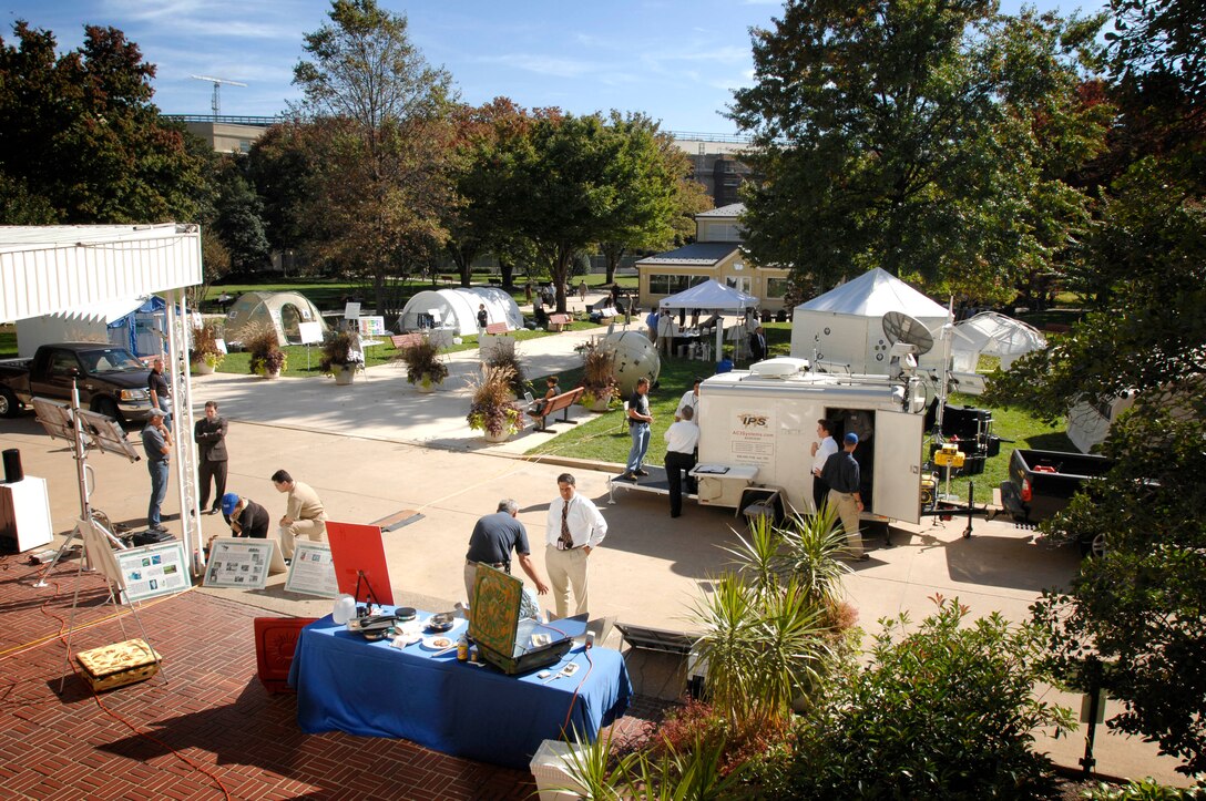 About a dozen companies gather in the Pentagon courtyard for a STAR-TIDES research demonstration. STAR-TIDES stands for sustainable technologies, accelerated research - transportable infrastructures for development and emergency support. DoD photo by Fred W. Baker III