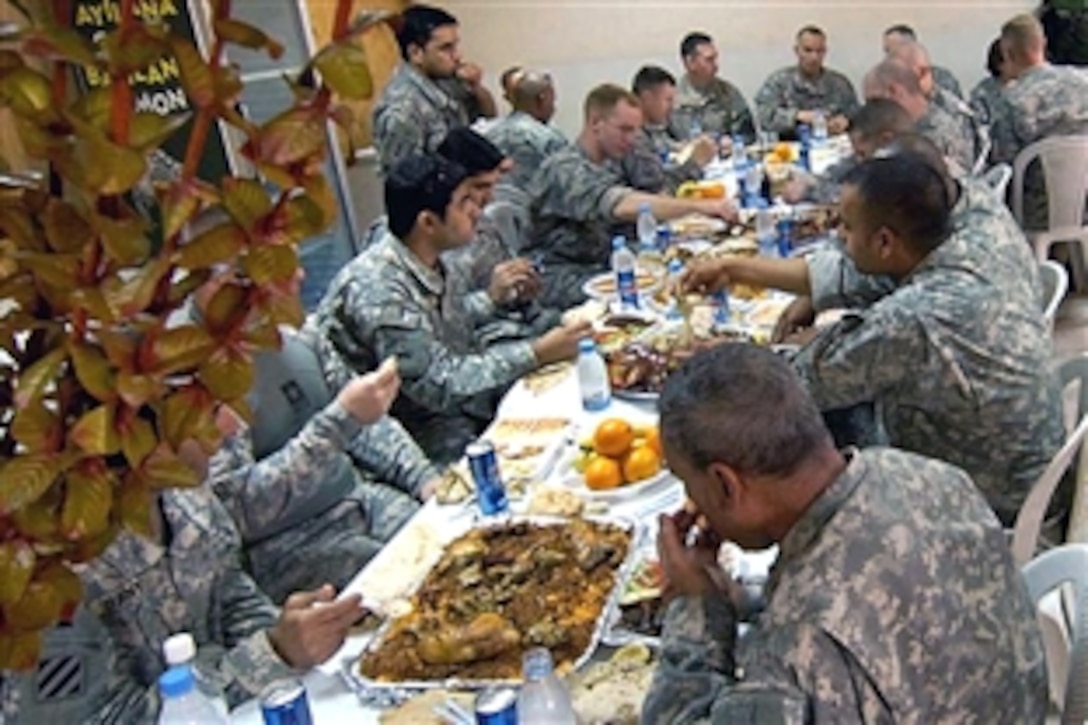 After meeting with their Iraqi counterparts, U.S. Army soldiers dine at the 9th Iraqi Army Division headquarters in al-Rashid, Iraq, Oct. 7, 2008. The soldiers are assigned to the 1st Armored Division, 2nd Brigade Combat Team. 
