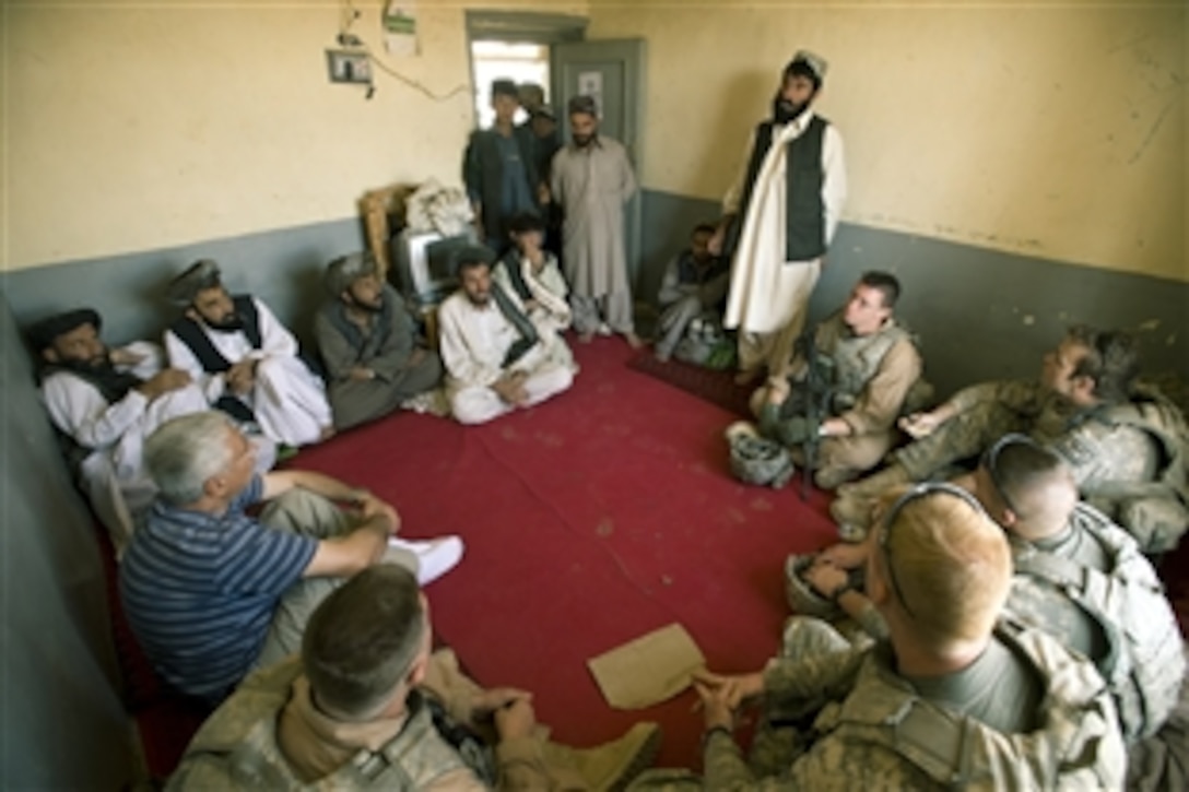 U.S. service members from the Zabul Provincial Reconstruction Team and Kuchi tribe leaders meet in the Qalat province of Afghanistan Oct. 10, 2008, to discuss ways to assist the tribe during the upcoming winter. The Kuchis, a nomadic tribe, have lost a large number of livestock due to drought. 