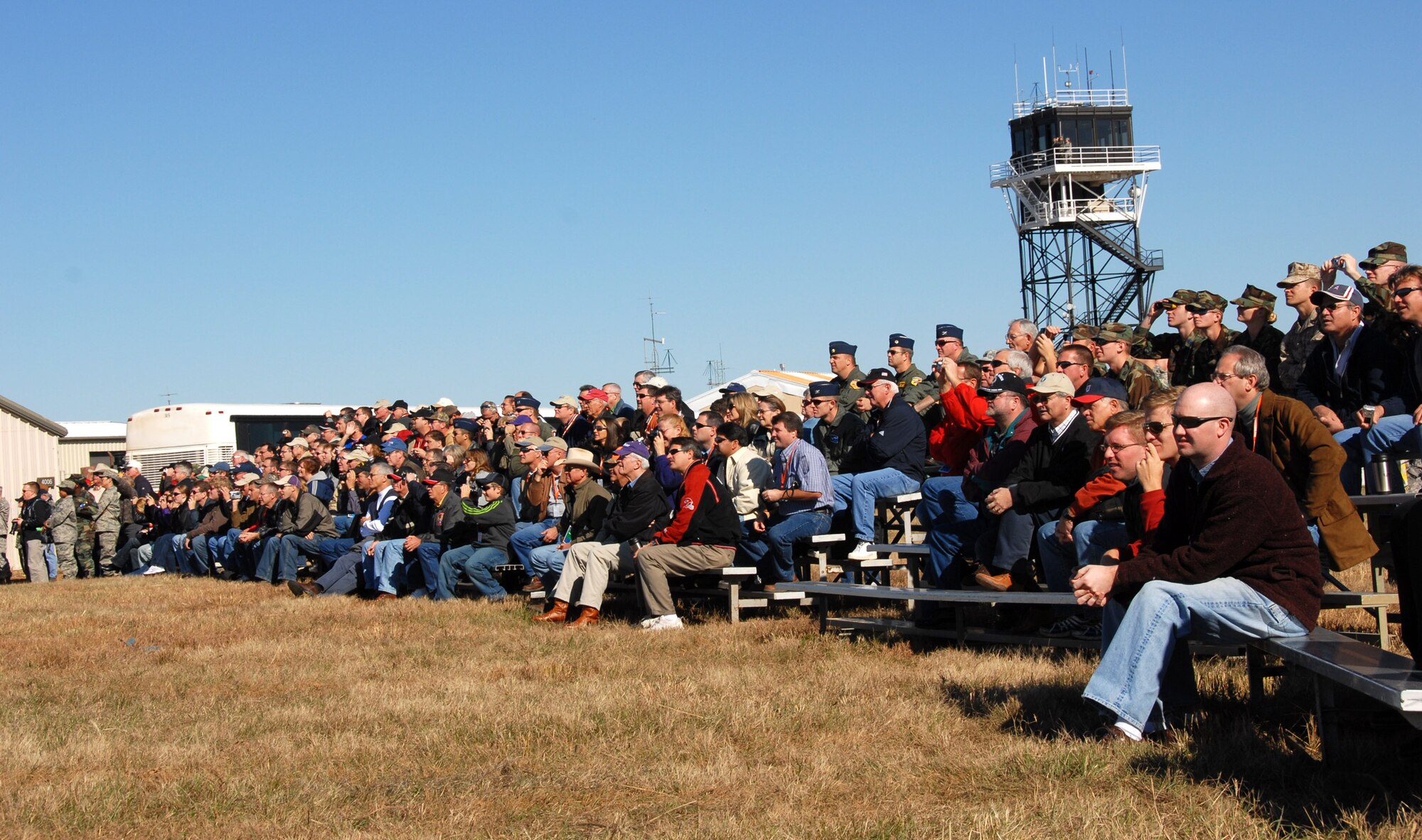 Distinguished visitors and news media watch A-10 Thunderbolt II aircraft make strafing and bombing runs at the Smoky Hill Range near Salina, Kan., Oct. 16 as part of Hawgsmoke 2008.  The four-day event is a bienniel gathering of A-10 squadrons from across the Air Force to compete in a bombing and aerial gunnery competition.  This year's Hawgsmoke was hosted by the 442nd Fighter Wing, an Air Force Reserve unit based at Whiteman Air Force Base, Mo.  (U.S. Air Force photo/Master Sgt. Bill Huntington)