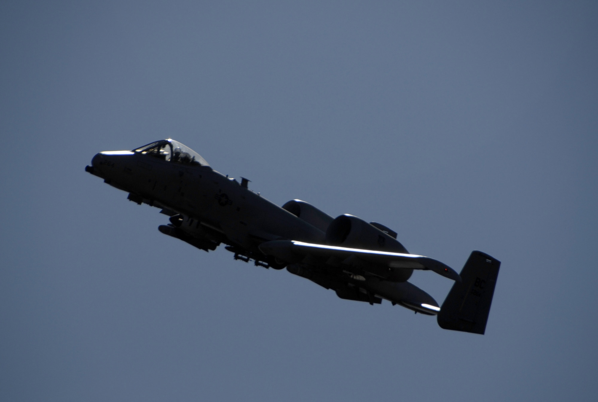 An A-10 Thunderbolt II from the 110th Fighter Wing, a Michigan Air National Guard unit based at Battle Creek, Mich., is silhouetted against the sun as the pilot turns to engage a target at the Smoky Hill Range near Salina, Kan., Oct. 16.  Fourteen A-10 units from across the Air Force competed this week in Hawgsmoke 2008, a bienniel A-10 bombing and aerial gunnery competition hosted by the Air Force Reserve's 442nd Fighter Wing, based at Whiteman Air Force Base, Mo.  (U.S. Air Force photo/Staff Sgt. Kent Kagarise)
