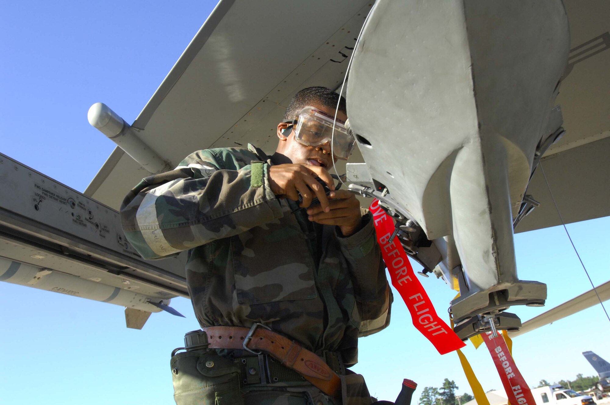 SHAW AIR FORCE BASE, S.C. --  Airman 1st Class Antonio Fisher, 79th Aircraft Maintenance Unit weapons loader, prepares wiring for a guided bomb unit on an F-16 Fighting Falcon during a Phase II Operational Readiness Exercise Oct. 16. OREs evaluate how quickly and accurately Airmen can prepare aircraft in a deployed location. (U.S. Air Force photo/Senior Airman William Coleman)