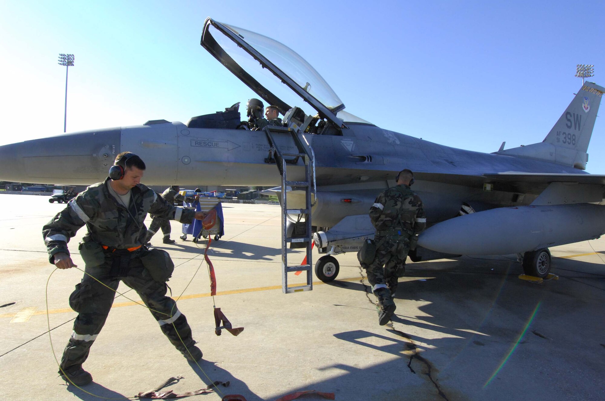 SHAW AIR FORCE BASE, S.C. --  Airmen from the 79th Fighter Squadron ground an F-16 Fighting Falcon before starting an aircraft regeneration during a Phase II Operational Readiness Exercise Oct. 16. OREs evaluate how quickly and accurately Airmen can prepare aircraft in a deployed location. (U.S. Air Force photo/Senior Airman William Coleman)