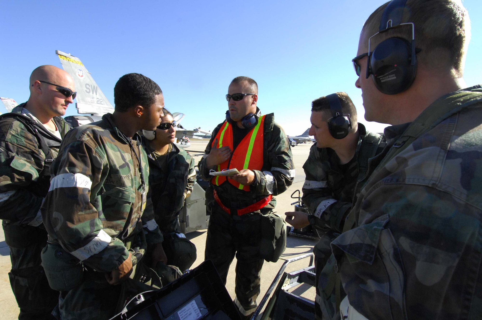 SHAW AIR FORCE BASE, S.C. -- Airmen from the 79th Fighter Squadron review check lists before starting an aircraft regeneration during a Phase II Operational Readiness Exercise Oct. 16. OREs evaluate how quickly and accurately Airmen can prepare aircraft in a deployed location. (U.S. Air Force photo/Senior Airman William Coleman)