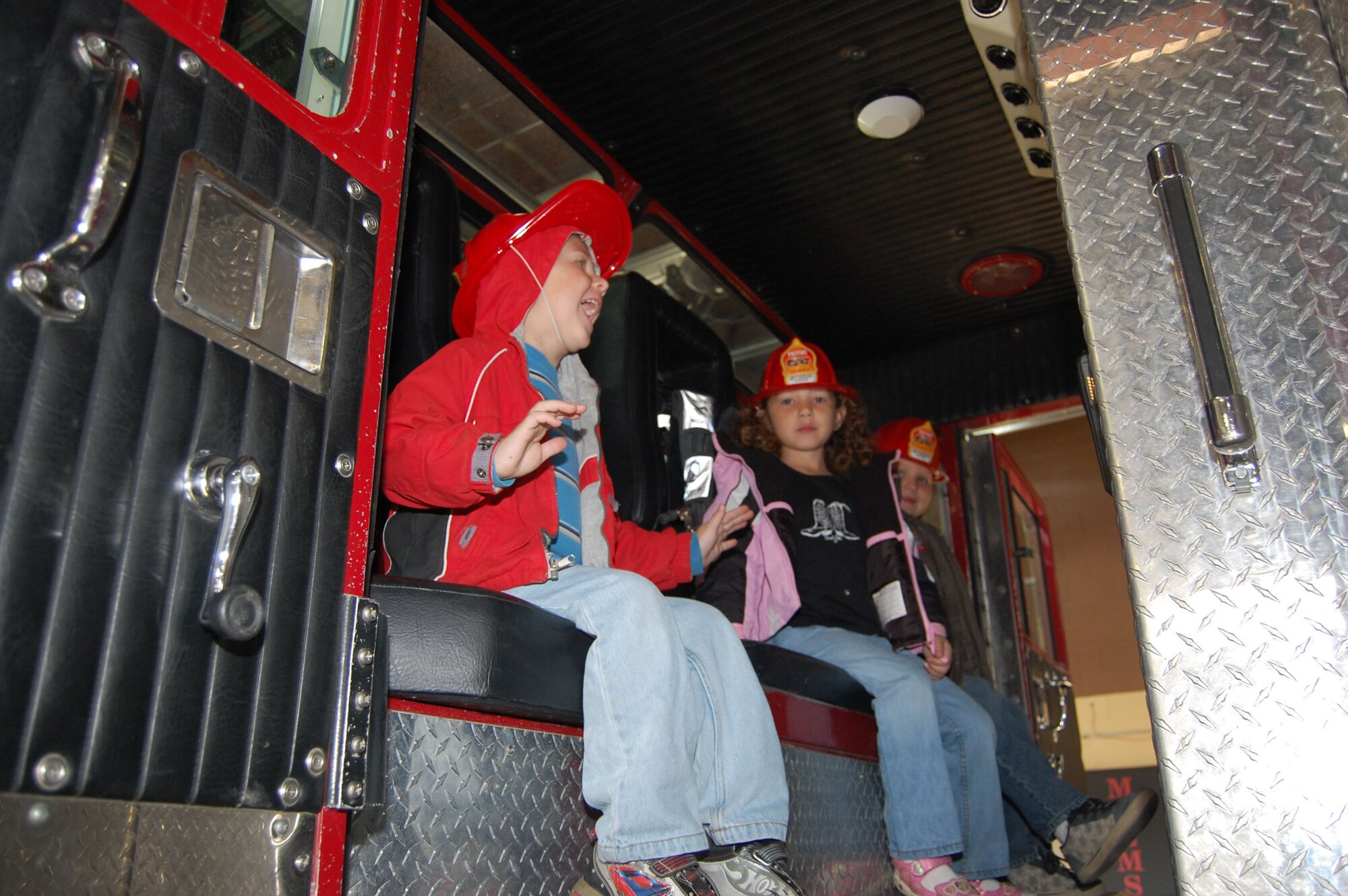 Little Warriors from Loy Elementary School get a chance to sit inside a fire truck during a tour of Malmstrom's Fire Department. (U.S. Air Force photo/Senior Airman Emerald Ralston)