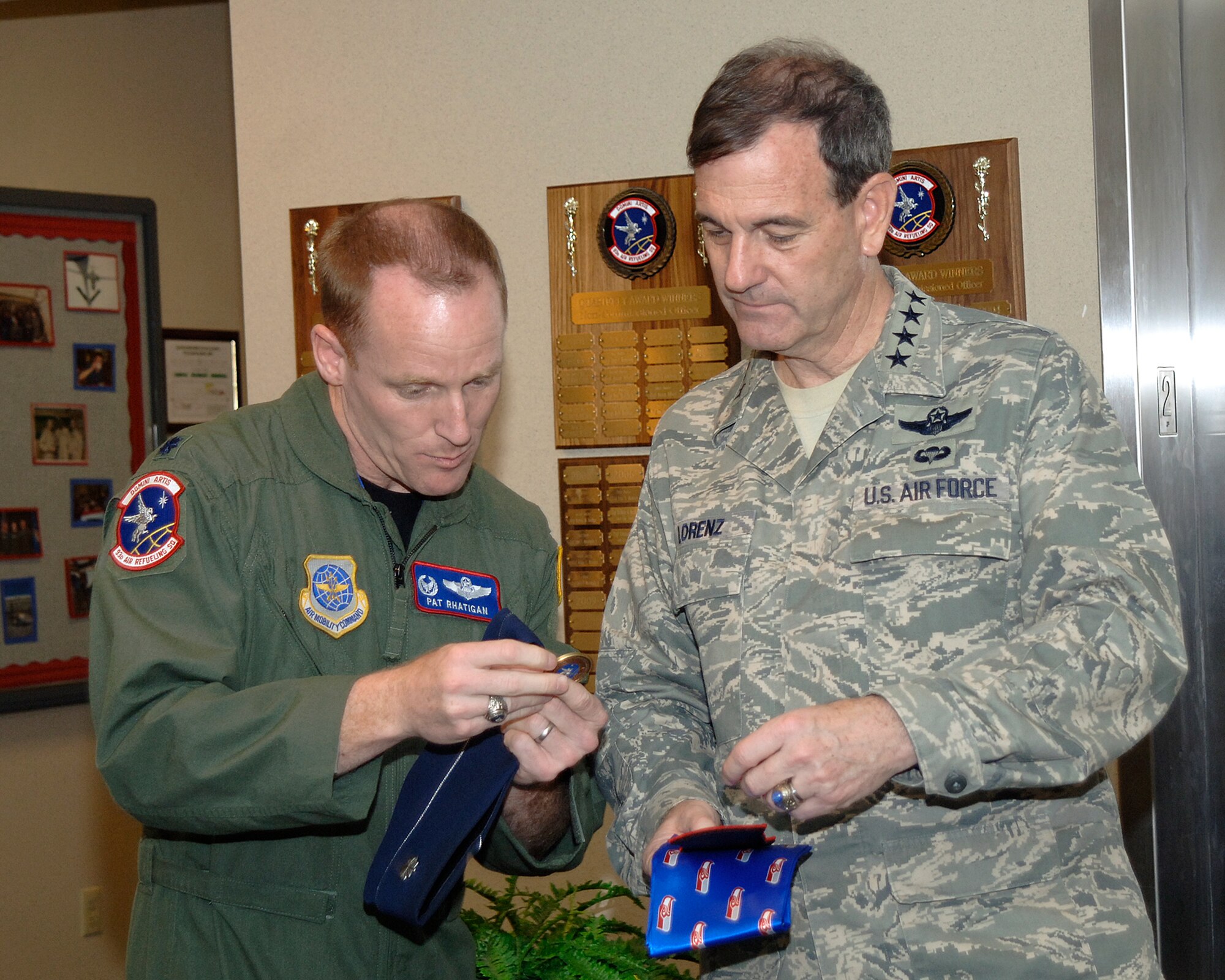 FAIRCHILD AIR FORCE BASE, Wash. – Gen. Stephen Lorenz, Air Education Training Command commander exchanges coins with Lt. Col. Patrick Rhatigan, 93rd Air Refueling commander on Oct 15. General Lorenz and Colonel Rhatigan discussed various topics during his visit to the squadron. (U.S. Air Force photo / Staff Sgt. JT May III)