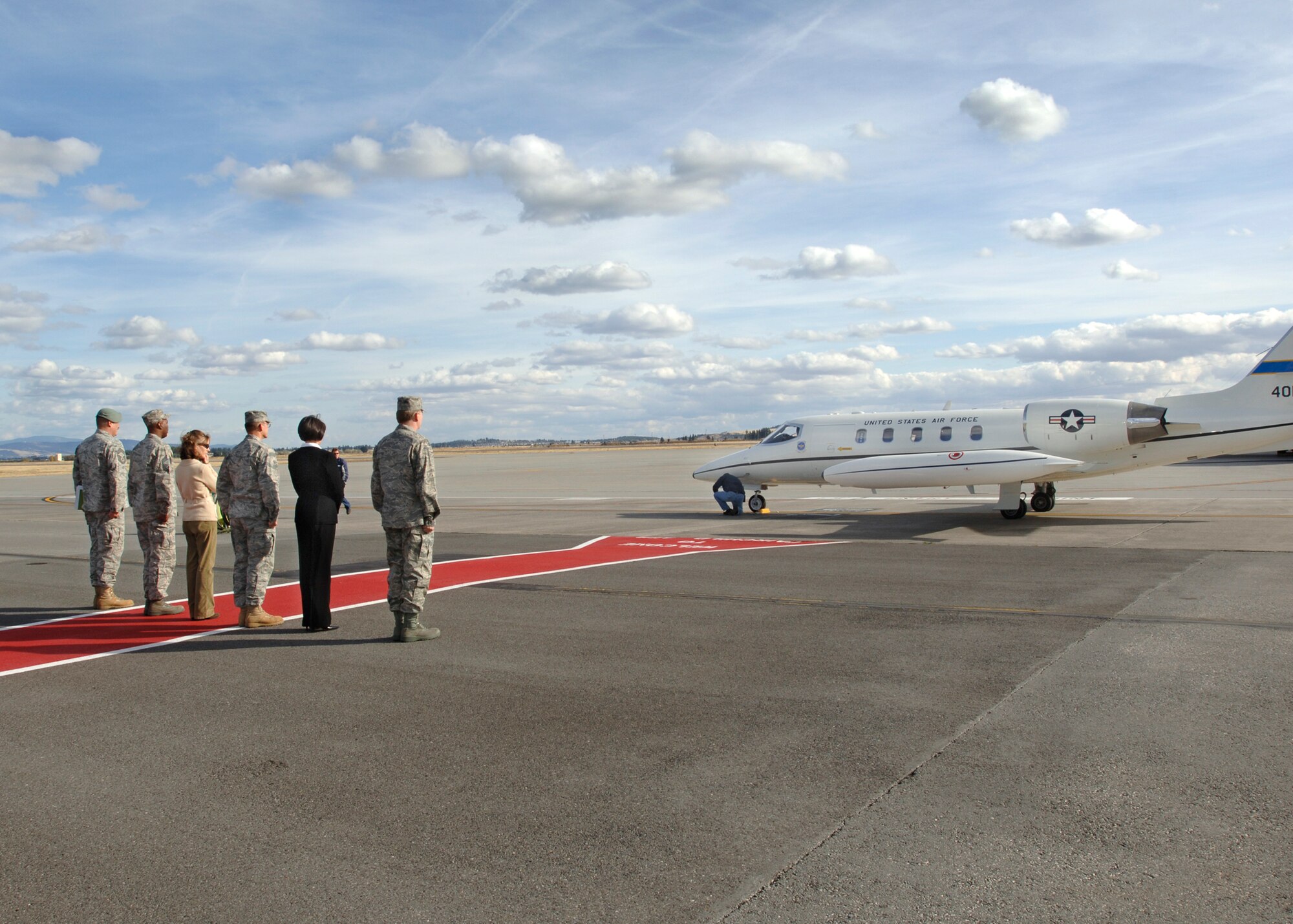 FAIRCHILD AIR FORCE BASE, Wash. – Chief Master Sgt. Mark Berstler, 336th Training Group command chief; Chief Master Sgt. Gerald Gooding, 92nd Mission Support Group superintendent; Col. Scott Greene, 336th Training Group commander with wife Annie; and Col. Robert Thomas, 92nd Air Refueling Wing commander, with wife Mari wait to welcome Gen. Stephen Lorenz’s  arrival on Oct. 14. General Lorenz visited the base to get a closer observation of 336th TRG operations. (U.S. Air Force photo / Airman 1st Class Melissa Barnett)