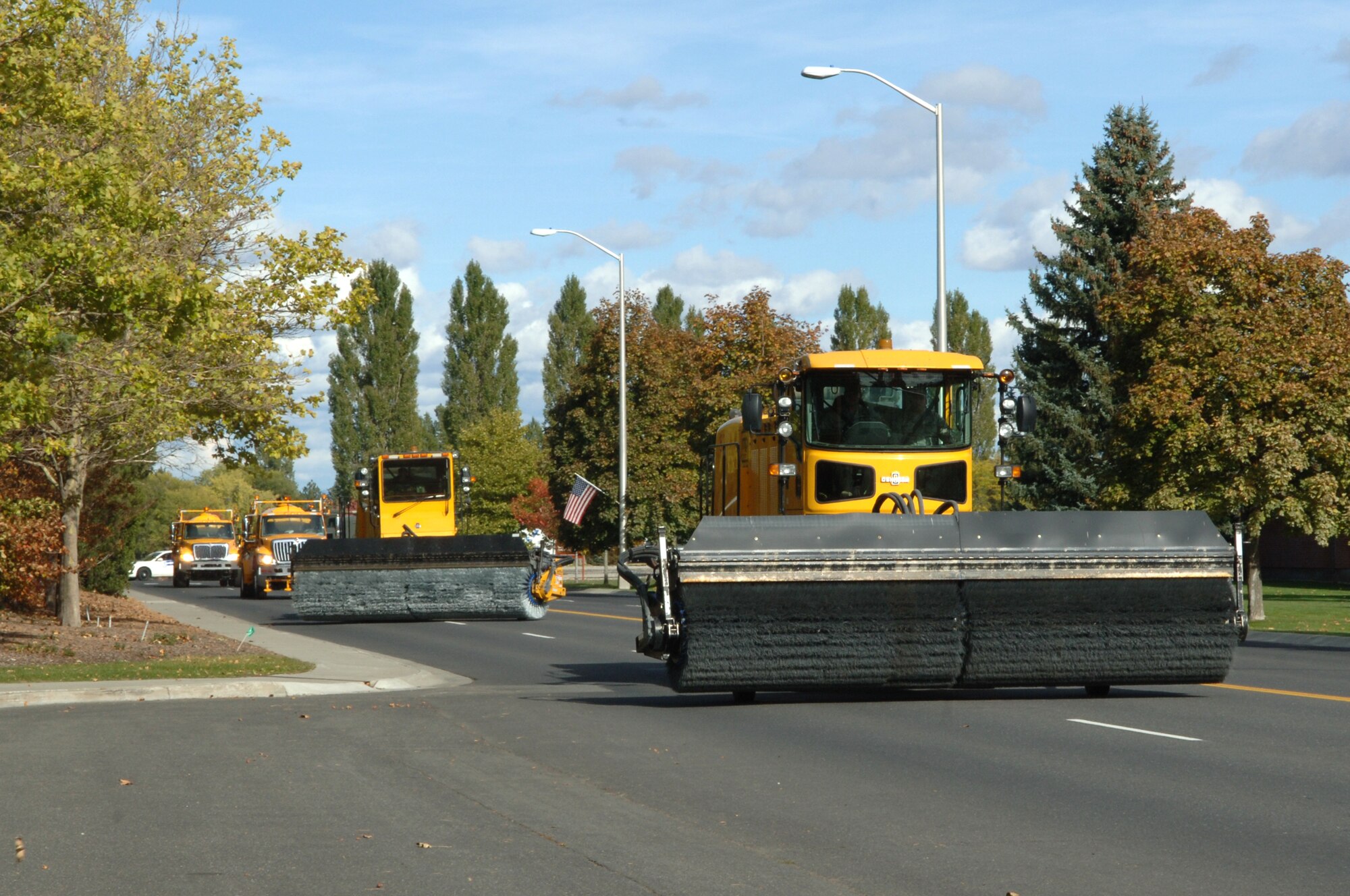 FAIRCHILD AIR FORCE BASE, Wash. – Two rotary and air-blast airfield sweepers are followed by the airfield deicer sprayers during the Snow Parade Oct. 14. Both are used to remove snow and ice from airfield pavement and ensure clear pavement for aircraft operations. (U.S. Air Force photo / Senior Airman Jocelyn A. Ford)