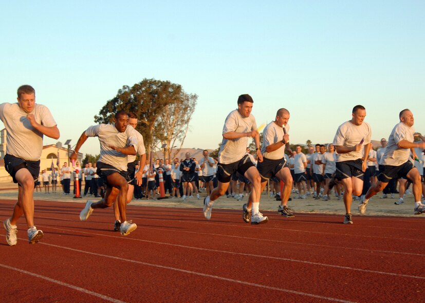 From left to right, Second Lieutenant Andrew Pratt, Master Sergeant Eric Dugger, Master Sergeant Lowell Olson, Lieutenant Colonel Byrl Engel, Master Sergeant Garrick Hill, First Lieutenant Matthew Harvey and Master Sergeant Robert Martin compete in a relay race prior to a Mission Support Group Fun at Travis Air Force Base. The winner of the race will lead the runners in the Fun Run.  USAF photo by Civ/Amanda Lopez